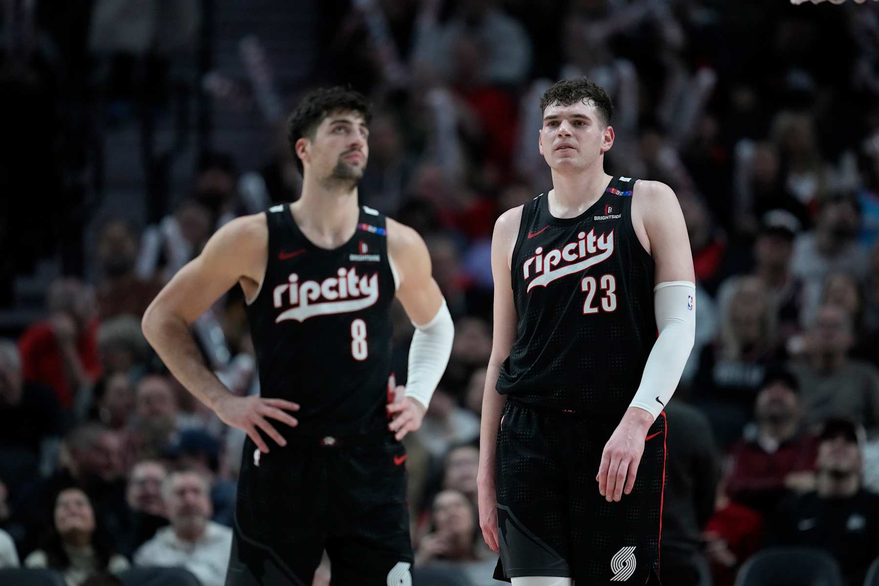 PORTLAND, OREGON - JANUARY 11: Deni Avdija #8 and Donovan Clingan #23 of the Portland Trail Blazers look on during the second half against the Miami Heat at Moda Center on January 11, 2025 in Portland, Oregon. NOTE TO USER: User expressly acknowledges and agrees that, by downloading and or using this photograph, User is consenting to the terms and conditions of the Getty Images License Agreement. (Photo by Soobum Im/Getty Images)