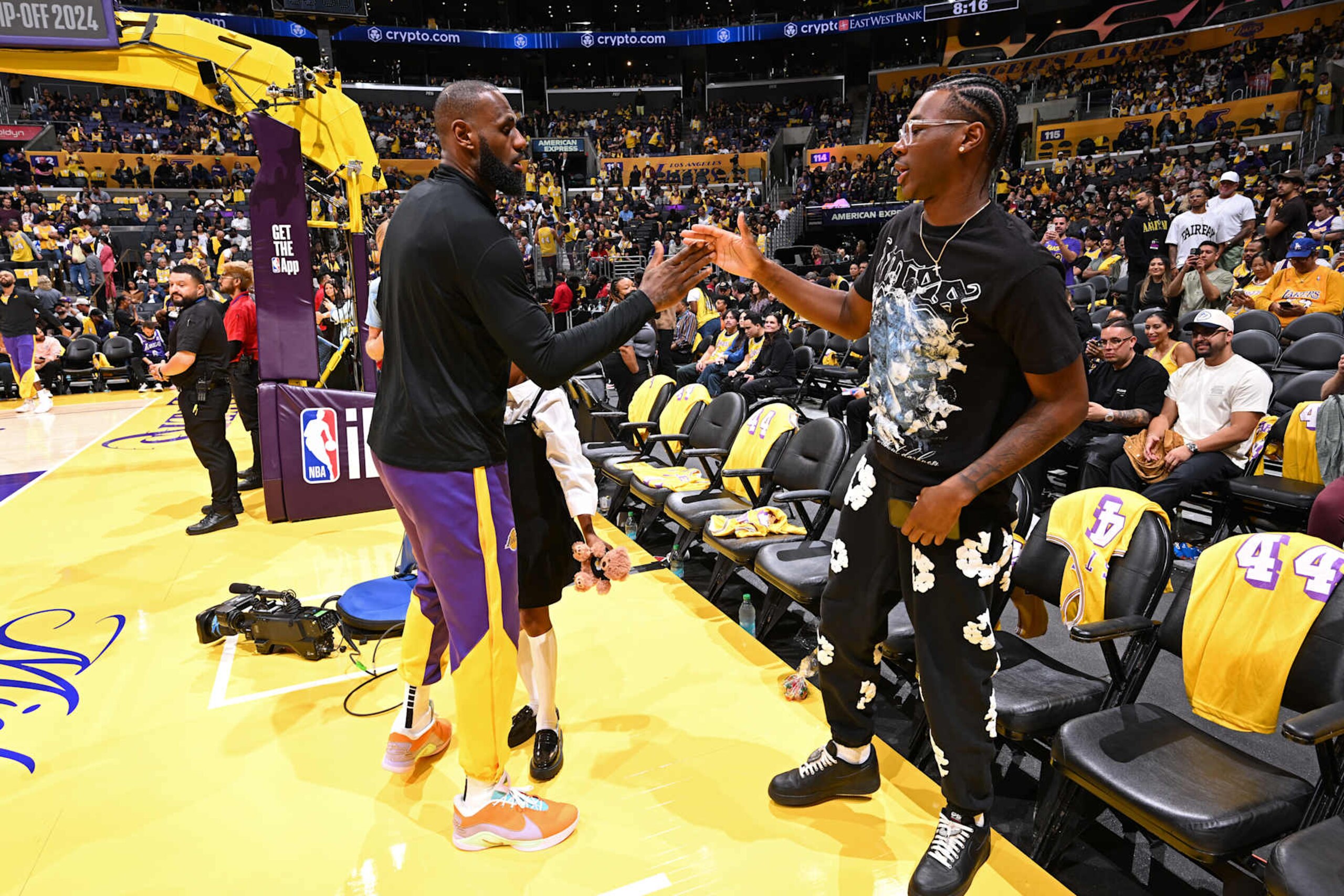 LOS ANGELES, CA - OCTOBER 22: LeBron James #23 of the Los Angeles Lakers high fives Bryce James during the game against the Minnesota Timberwolves on October 22, 2024 at Crypto.Com Arena in Los Angeles, California. NOTE TO USER: User expressly acknowledges and agrees that, by downloading and/or using this Photograph, user is consenting to the terms and conditions of the Getty Images License Agreement. Mandatory Copyright Notice: Copyright 2024 NBAE (Photo by Adam Pantozzi/NBAE via Getty Images) LOS ANGELES, CA - OCTOBER 22: LeBron James #23 of the Los Angeles Lakers high fives Bryce James during the game against the Minnesota Timberwolves on October 22, 2024 at Crypto.Com Arena in Los Angeles, California. NOTE TO USER: User expressly acknowledges and agrees that, by downloading and/or using this Photograph, user is consenting to the terms and conditions of the Getty Images License Agreement. Mandatory Copyright Notice: Copyright 2024 NBAE (Photo by Adam Pantozzi/NBAE via Getty Images)