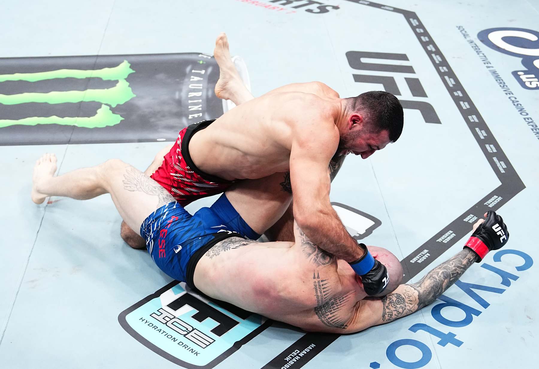 INGLEWOOD, CALIFORNIA - JANUARY 18: Azamat Bekoev of Russia punches Zachary Reese in a middleweight fight during the UFC 311 event at Intuit Dome on January 18, 2025 in Inglewood, California. (Photo by Jeff Bottari/Zuffa LLC)