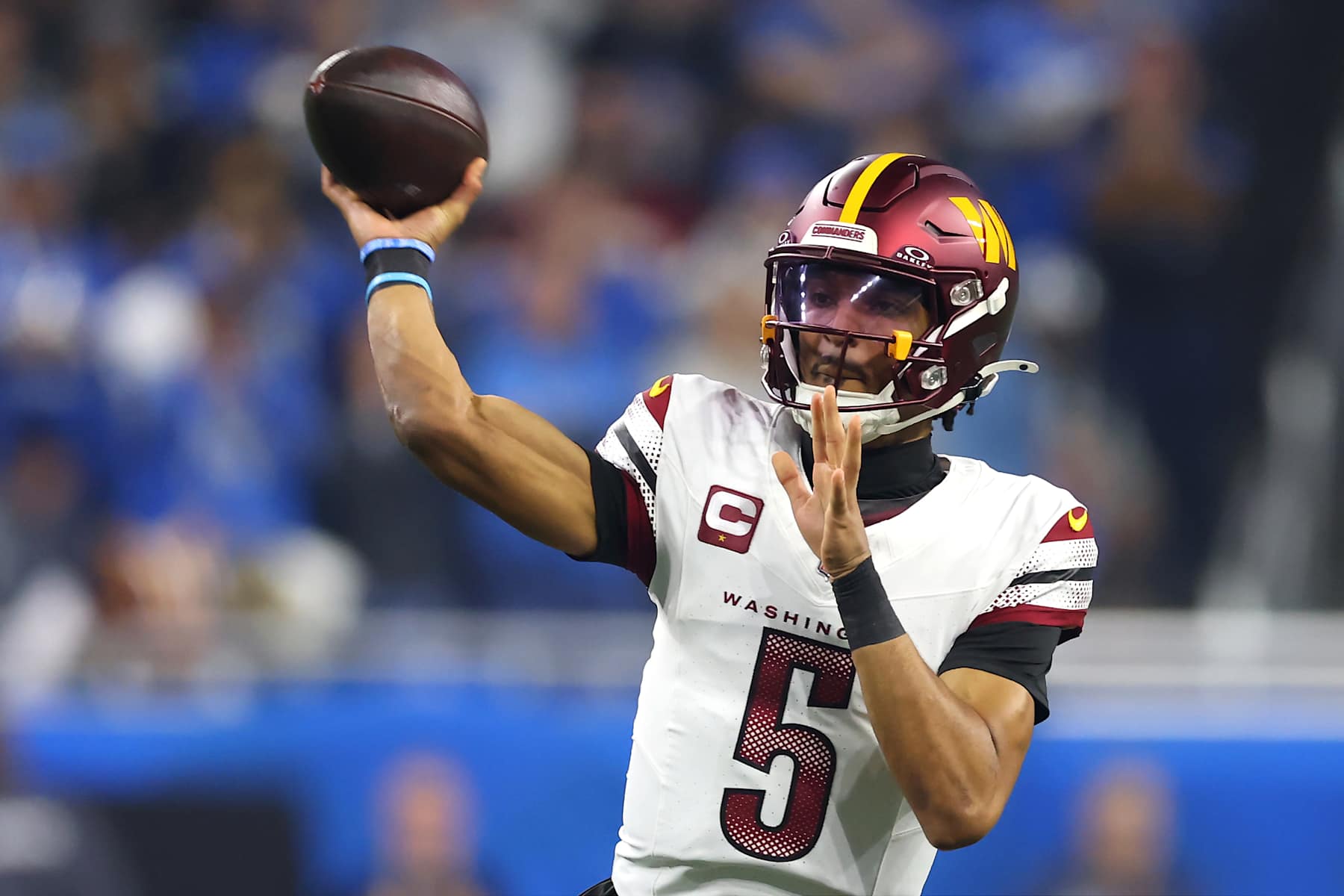 DETROIT, MICHIGAN - JANUARY 18: Jayden Daniels #5 of the Washington Commanders throws the ball during the first quarter against the Detroit Lions in the NFC Divisional Playoff at Ford Field on January 18, 2025 in Detroit, Michigan.  (Photo by Gregory Shamus/Getty Images)