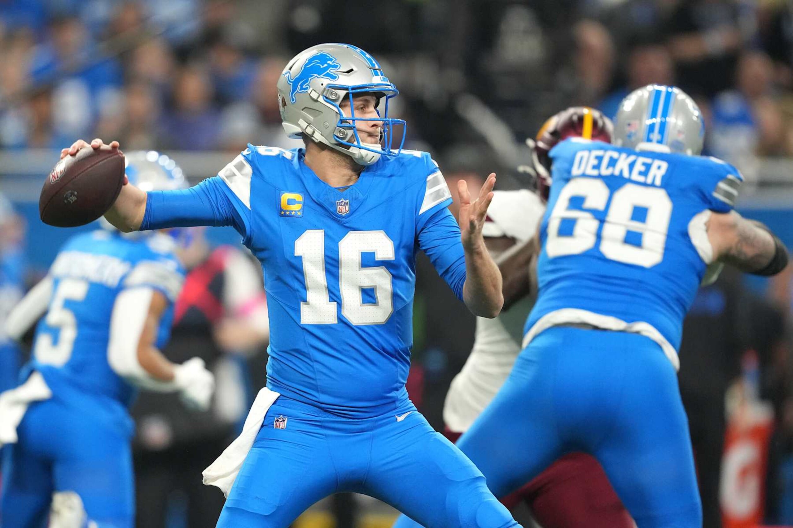 DETROIT, MICHIGAN - JANUARY 18: Jared Goff #16 of the Detroit Lions throws the ball during the second quarter against the Washington Commanders in the NFC Divisional Playoff at Ford Field on January 18, 2025 in Detroit, Michigan. (Photo by Nic Antaya/Getty Images) DETROIT, MICHIGAN - JANUARY 18: Jared Goff #16 of the Detroit Lions throws the ball during the second quarter against the Washington Commanders in the NFC Divisional Playoff at Ford Field on January 18, 2025 in Detroit, Michigan. (Photo by Nic Antaya/Getty Images)
