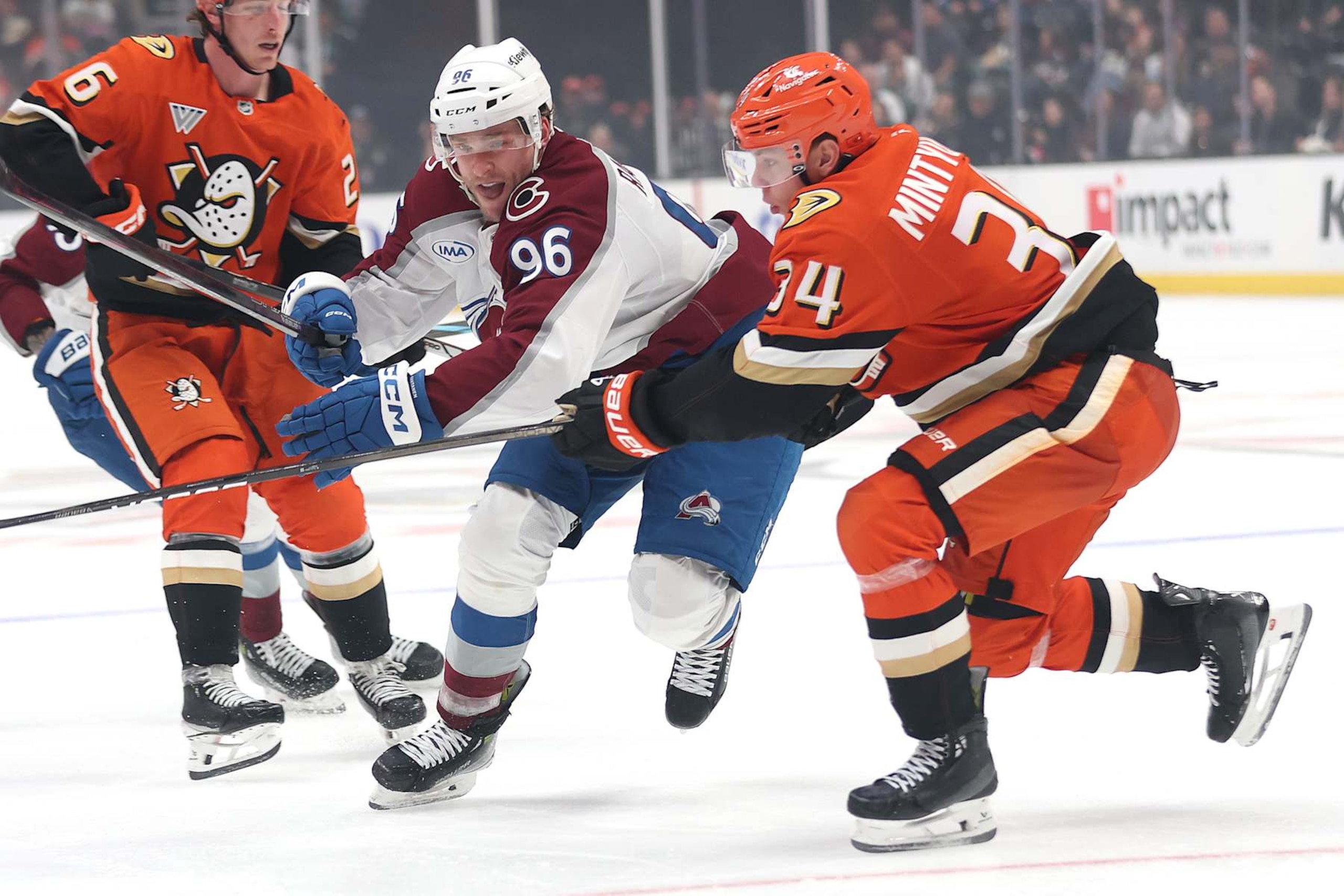 ANAHEIM, CALIFORNIA - DECEMBER 20: Pavel Mintyukov #34 of the Anaheim Ducks defends against Mikko Rantanen #96 of the Colorado Avalanche during the third period of a game at Honda Center on December 20, 2024 in Anaheim, California. (Photo by Sean M. Haffey/Getty Images)