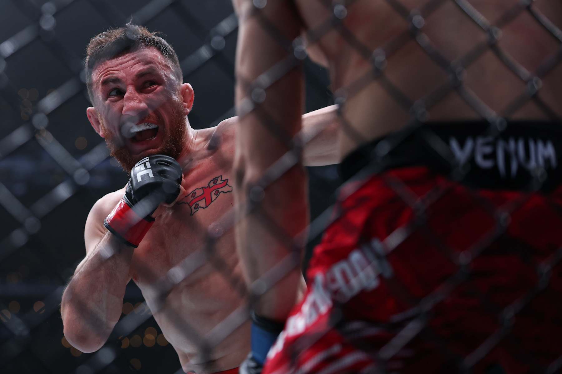 INGLEWOOD, CALIFORNIA - JANUARY 18: Merab Dvalishvili of Georgia strikes Umar Nurmagomedov of Russia in a bantamweight title fight during UFC 311 at Intuit Dome on January 18, 2025 in Inglewood, California. (Photo by Harry How/Getty Images)