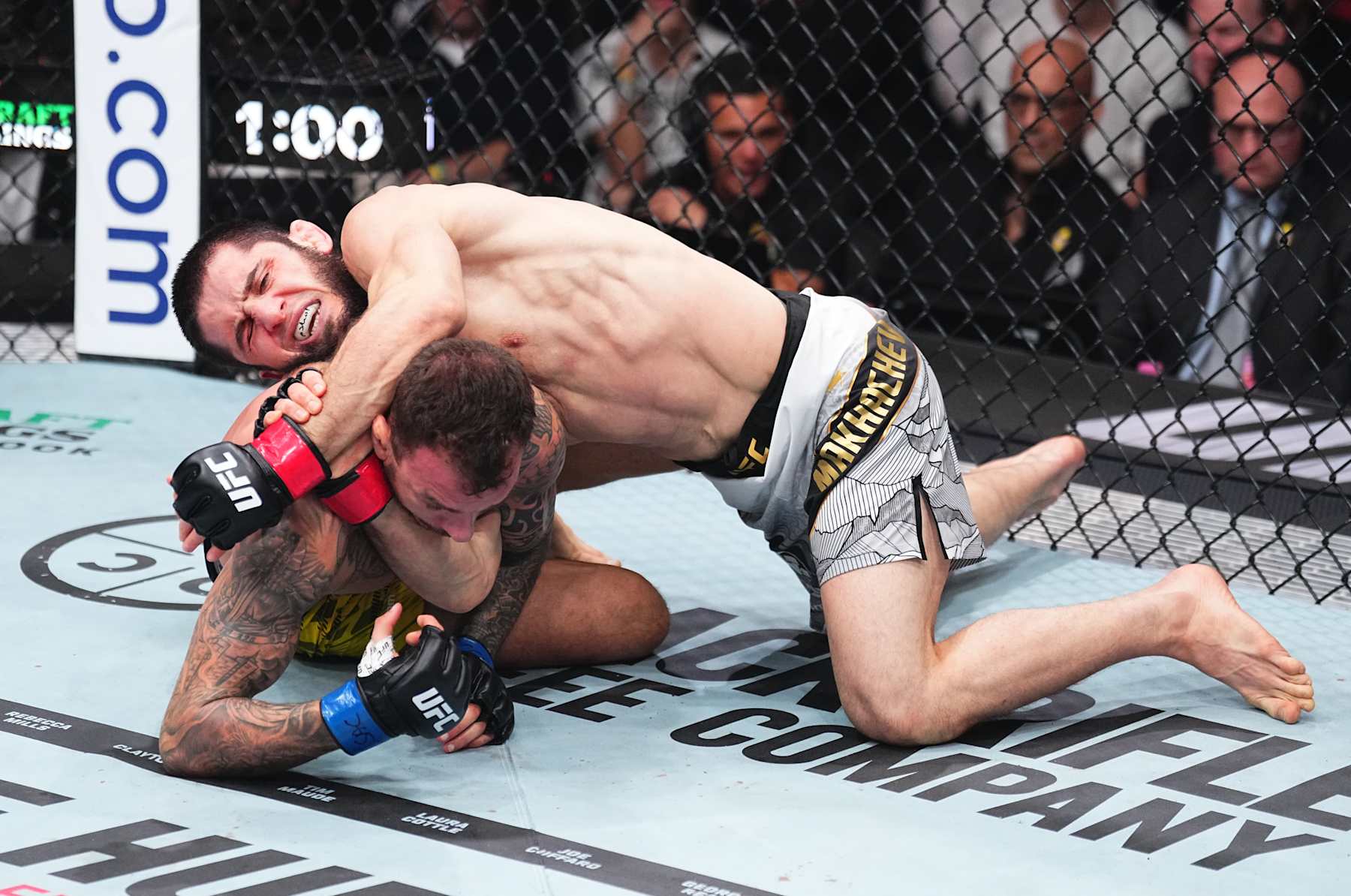 INGLEWOOD, CALIFORNIA - JANUARY 18: Islam Makhachev of Russia secures a submission against Renato Moicano of Brazil in the UFC lightweight championship fight during the UFC 311 event at Intuit Dome on January 18, 2025 in Inglewood, California. (Photo by Jeff Bottari/Zuffa LLC)