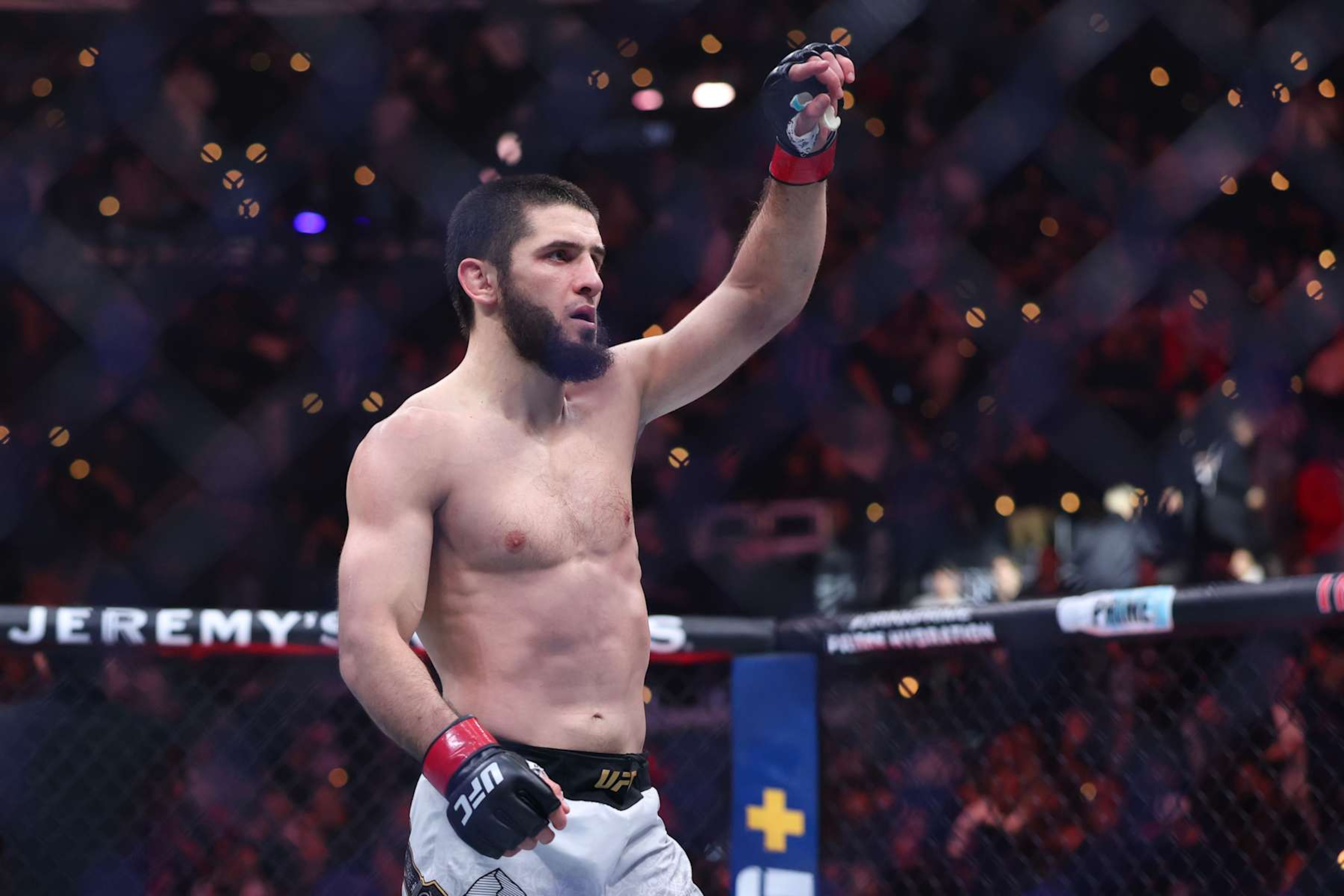 INGLEWOOD, CALIFORNIA - JANUARY 18: Islam Makhachev of Russia reacts after his victor by submission over Renato Moicano of Brazil, not pictured, in a lightweight title fight during UFC 311 at Intuit Dome on January 18, 2025 in Inglewood, California. (Photo by Harry How/Getty Images)