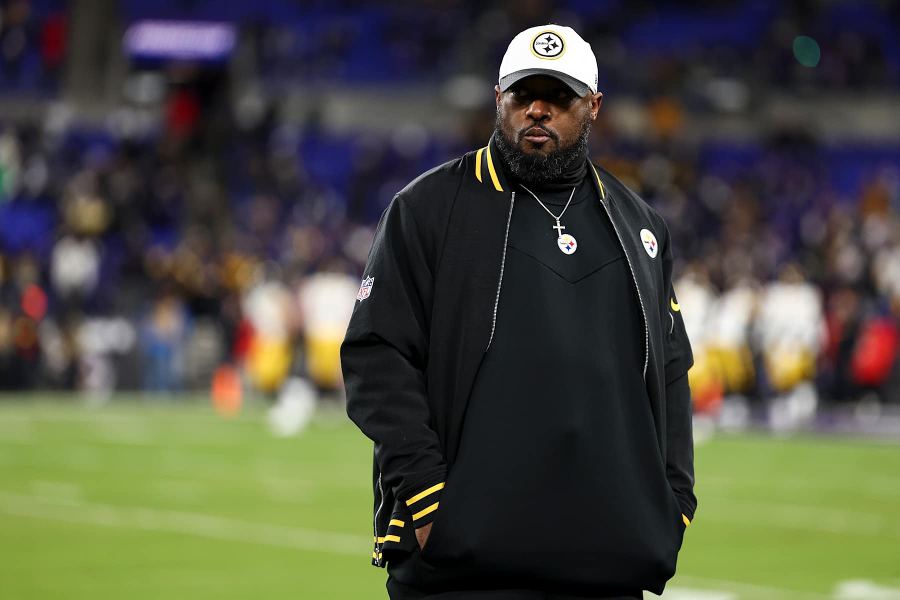 BALTIMORE, MARYLAND - JANUARY 11: Head coach Mike Tomlin of the Pittsburgh Steelers looks on prior to an NFL football wild card playoff game against the Baltimore Ravens at M&T Bank Stadium on January 11, 2025 in Baltimore, Maryland. (Photo by Kevin Sabitus/Getty Images) BALTIMORE, MARYLAND - JANUARY 11: Head coach Mike Tomlin of the Pittsburgh Steelers looks on prior to an NFL football wild card playoff game against the Baltimore Ravens at M&T Bank Stadium on January 11, 2025 in Baltimore, Maryland. (Photo by Kevin Sabitus/Getty Images)
