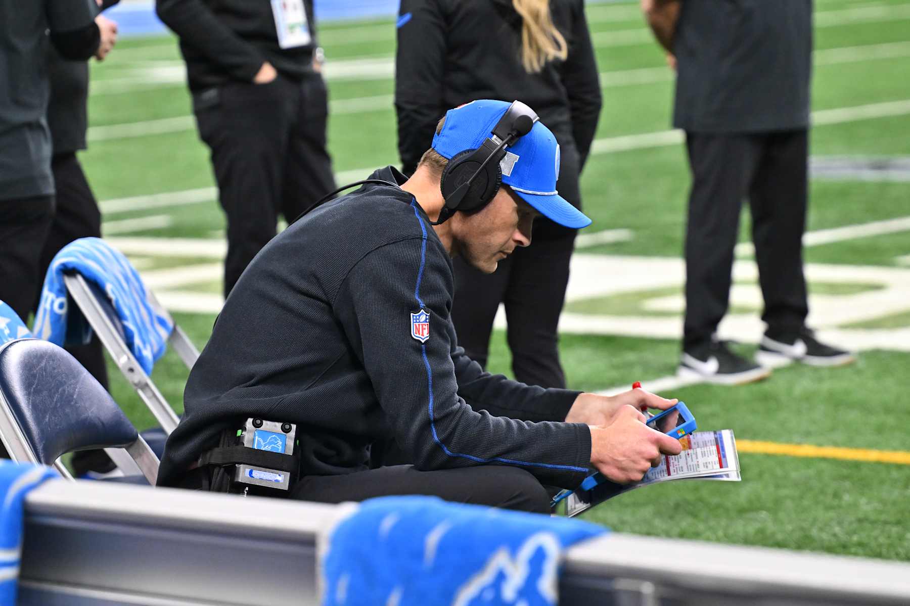 DETROIT, MI - JANUARY 18: Detroit Lions offensive coordinator Ben Johnson sits on the sidelines looking at replays during the NFC Divisional Playoff game between the Detroit Lions and the Washington Commanders on Sunday January 18, 2025 at Ford Field in Detroit, MI. (Photo by Steven King/Icon Sportswire via Getty Images) DETROIT, MI - JANUARY 18: Detroit Lions offensive coordinator Ben Johnson sits on the sidelines looking at replays during the NFC Divisional Playoff game between the Detroit Lions and the Washington Commanders on Sunday January 18, 2025 at Ford Field in Detroit, MI. (Photo by Steven King/Icon Sportswire via Getty Images)