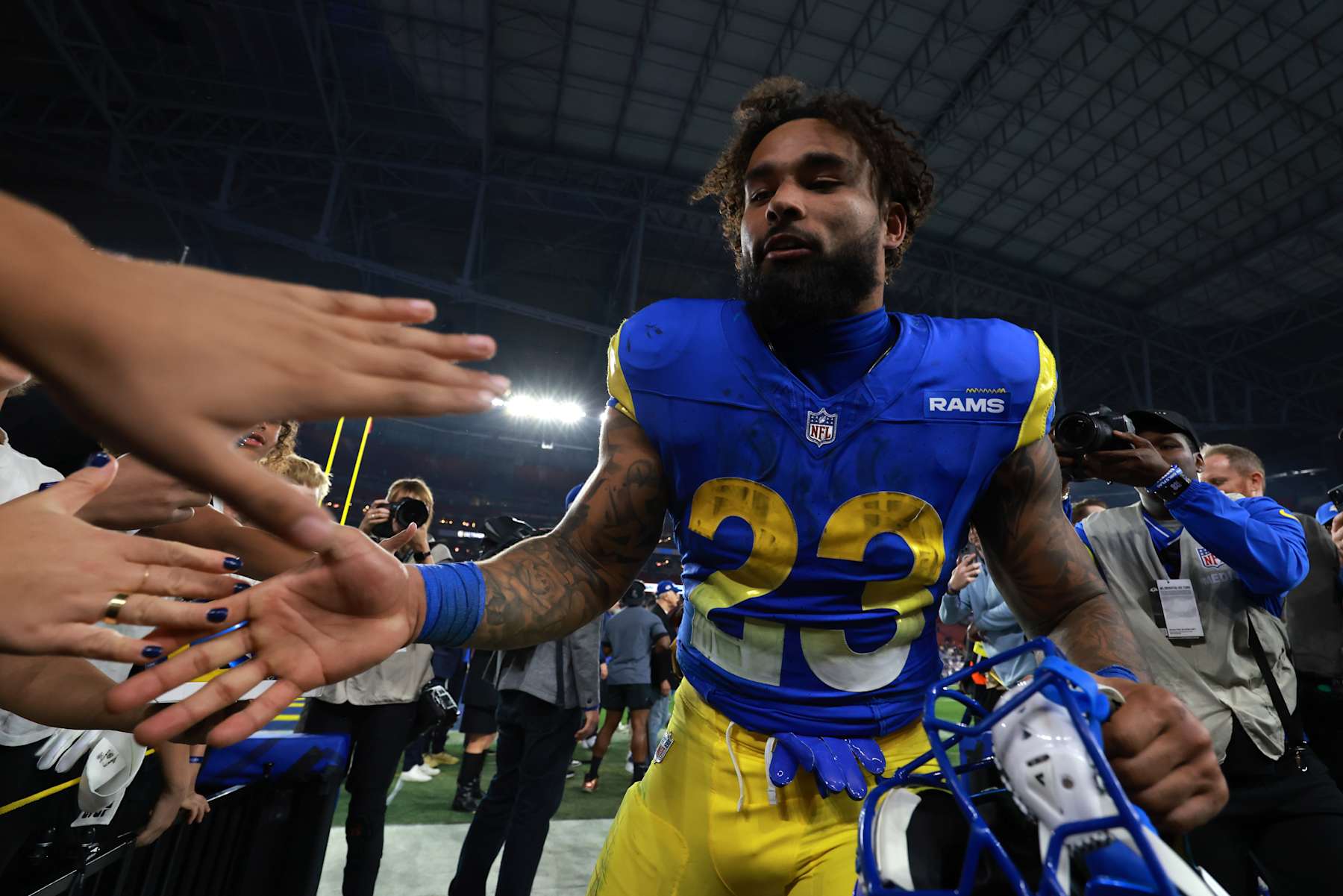 GLENDALE, ARIZONA - JANUARY 13: Kyren Williams #23 of the Los Angeles Rams celebrates with fans after a win over the Minnesota Vikings during the NFC Wild Card Playoff at State Farm Stadium on January 13, 2025 in Glendale, Arizona. (Photo by Christian Petersen/Getty Images) GLENDALE, ARIZONA - JANUARY 13: Kyren Williams #23 of the Los Angeles Rams celebrates with fans after a win over the Minnesota Vikings during the NFC Wild Card Playoff at State Farm Stadium on January 13, 2025 in Glendale, Arizona. (Photo by Christian Petersen/Getty Images)