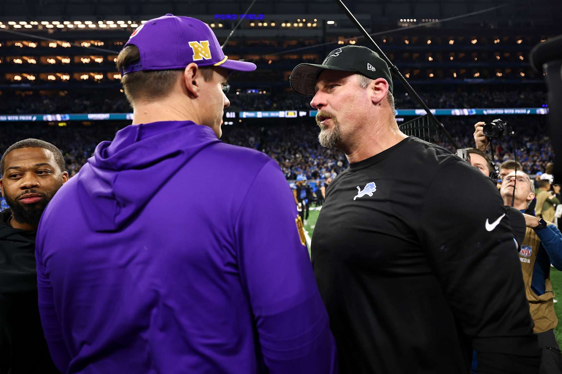 DETROIT, MICHIGAN - JANUARY 5: Head coach Dan Campbell of the Detroit Lions talks with head coach Kevin O'Connell of the Minnesota Vikings after an NFL football game at Ford Field on January 5, 2025 in Detroit, Michigan. (Photo by Kevin Sabitus/Getty Images) DETROIT, MICHIGAN - JANUARY 5: Head coach Dan Campbell of the Detroit Lions talks with head coach Kevin O'Connell of the Minnesota Vikings after an NFL football game at Ford Field on January 5, 2025 in Detroit, Michigan. (Photo by Kevin Sabitus/Getty Images)