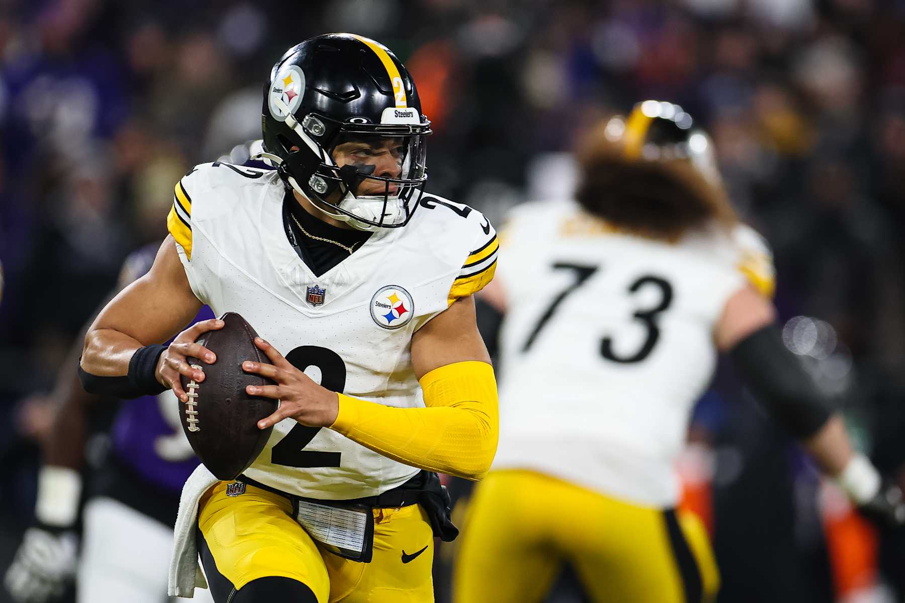 BALTIMORE, MD - JANUARY 11: Justin Fields #2 of the Pittsburgh Steelers carries the ball against the Baltimore Ravens during the first half of the AFC Wild Card Playoff game at M&T Bank Stadium on January 11, 2025 in Baltimore, Maryland. (Photo by Scott Taetsch/Getty Images)