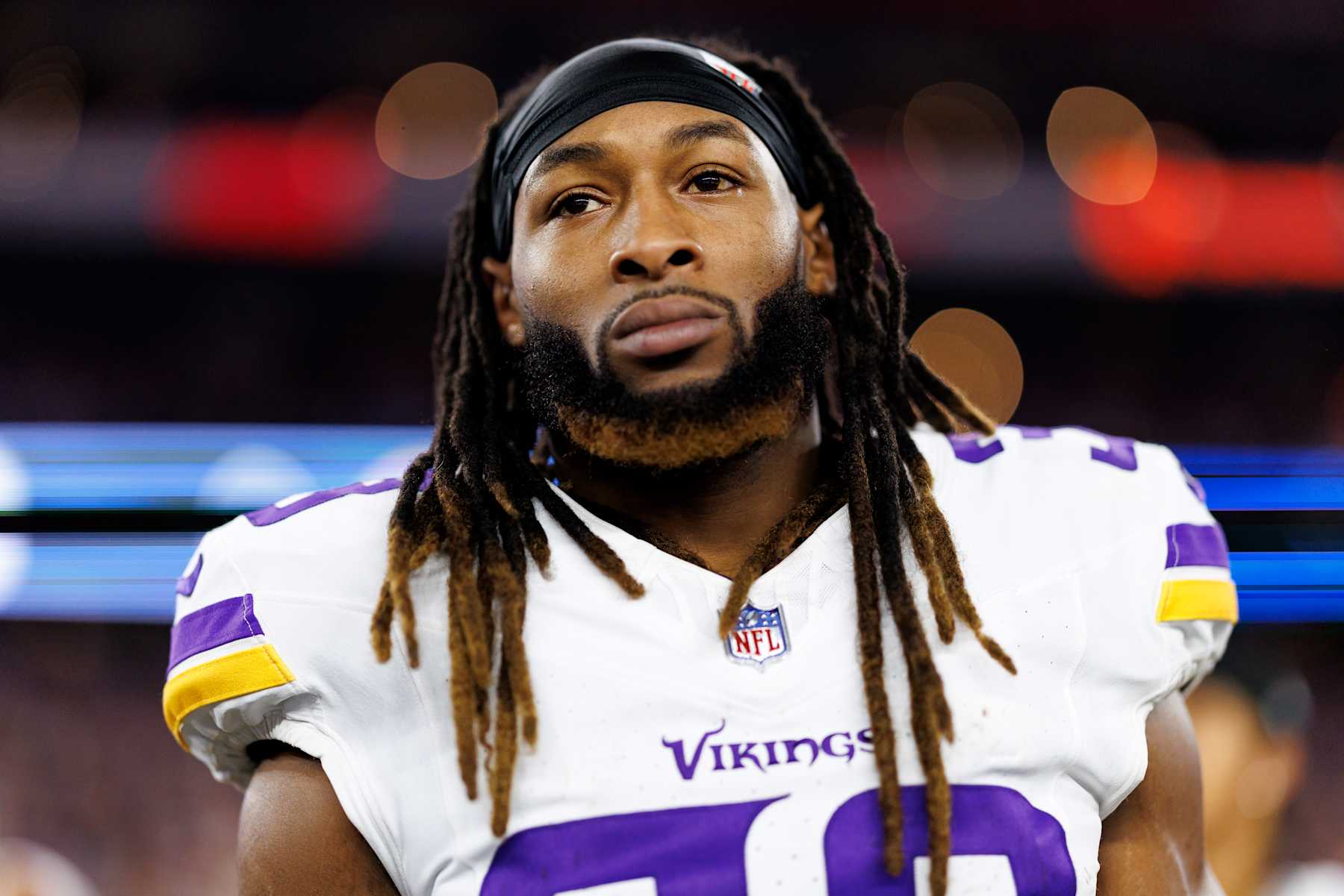 GLENDALE, ARIZONA - JANUARY 13: Running back Aaron Jones #33 of the Minnesota Vikings stands on the sidelines during the national anthem prior to an NFC Wild Card game against the Los Angeles Rams, at State Farm Stadium on January 13, 2025 in Glendale, Arizona. (Photo by Brooke Sutton/Getty Images)