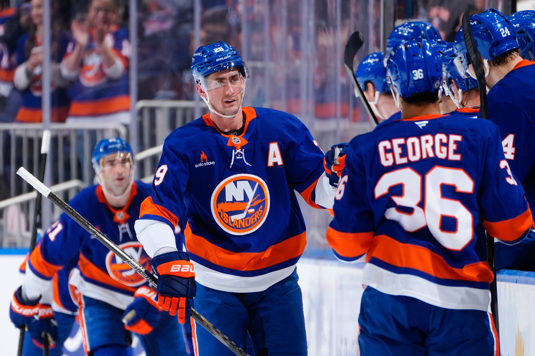 ELMONT, NEW YORK - JANUARY 18:  Brock Nelson #29 of the New York Islanders is congratulated by his teammates after scoring a goal against the San Jose Sharks during the second period at UBS Arena on January 18, 2025 in Elmont, New York. (Photo by Mike Stobe/NHLI via Getty Images)
