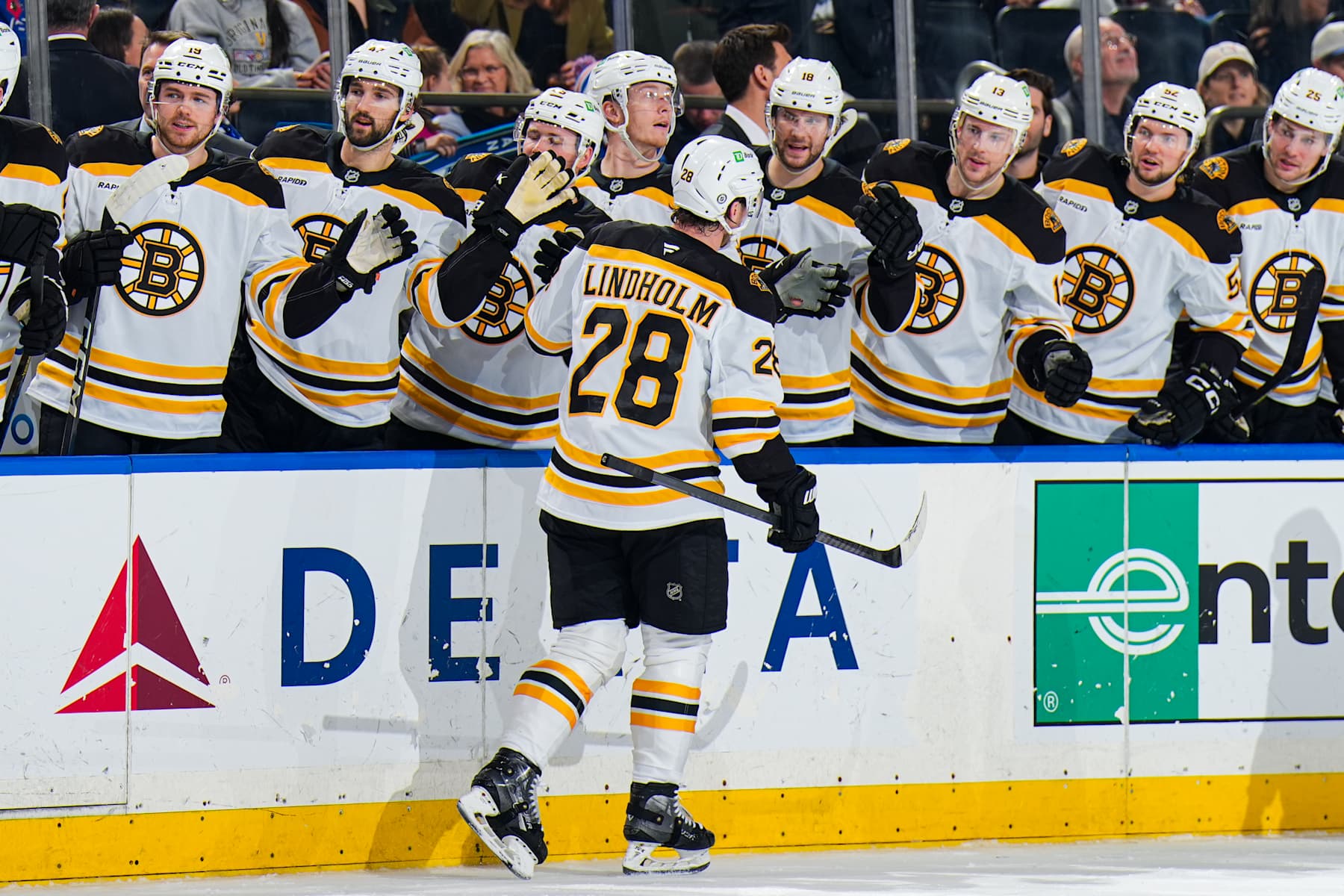NEW YORK, NEW YORK - JANUARY 02:  Elias Lindholm #28 of the Boston Bruins celebrates with teammates after scoring a goal in the second period against the New York Rangers at Madison Square Garden on January 2, 2024 in New York City. (Photo by Jared Silber/NHLI via Getty Images)