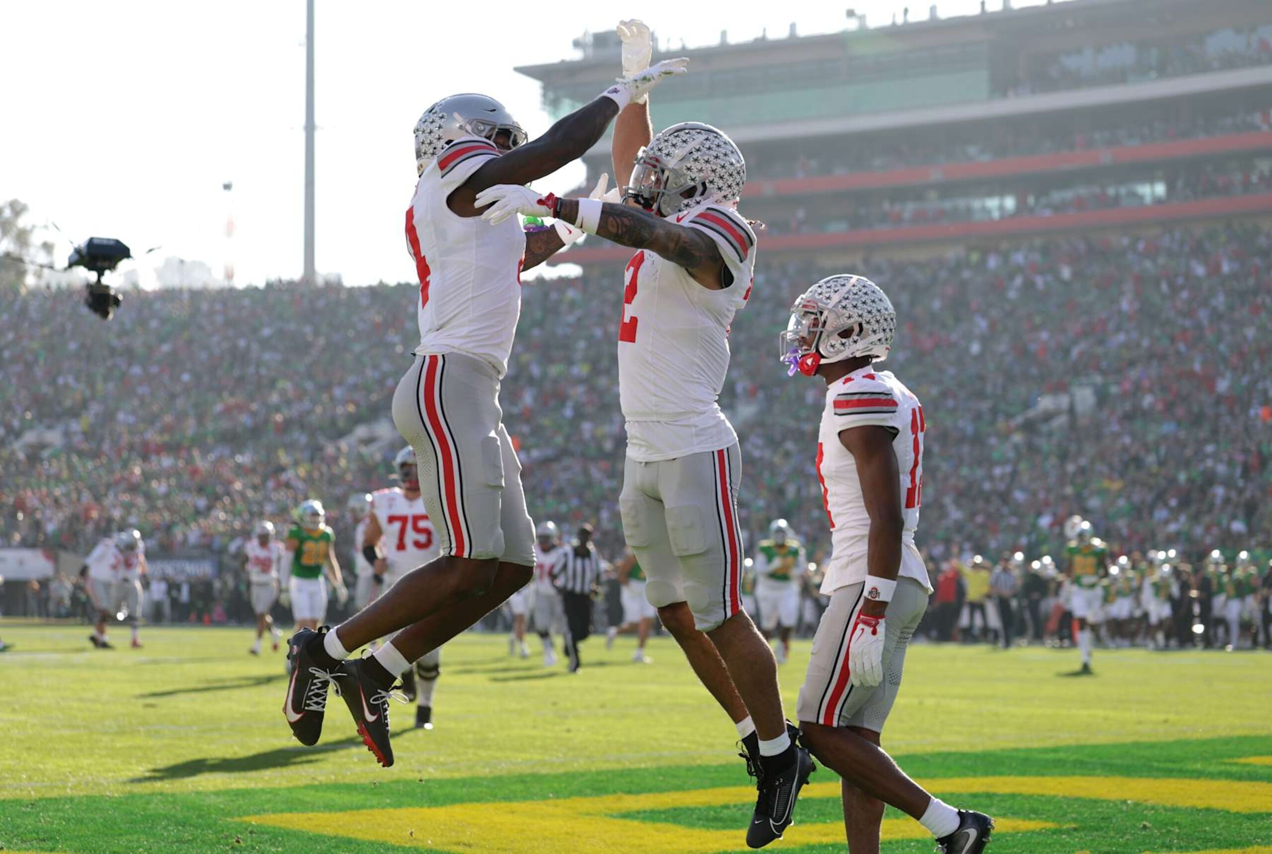 PASADENA, CALIFORNIA - JANUARY 01: Emeka Egbuka #2 of the Ohio State Buckeyes celebrates a touchdown with Jeremiah Smith #4 during the first quarter against the Oregon Ducks during the Rose Bowl Game Presented by Prudential at Rose Bowl Stadium on January 01, 2025 in Pasadena, California. (Photo by Sean M. Haffey/Getty Images) PASADENA, CALIFORNIA - JANUARY 01: Emeka Egbuka #2 of the Ohio State Buckeyes celebrates a touchdown with Jeremiah Smith #4 during the first quarter against the Oregon Ducks during the Rose Bowl Game Presented by Prudential at Rose Bowl Stadium on January 01, 2025 in Pasadena, California. (Photo by Sean M. Haffey/Getty Images)