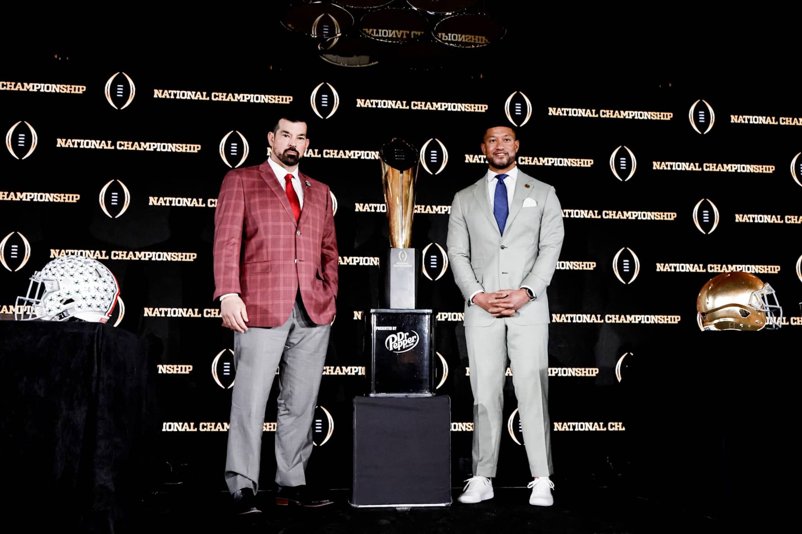 ATLANTA, GA - JANUARY 19: Head Coaches Ryan Day of the The Ohio State Buckeyes (L) and Marcus Freeman of the Notre Dame Fight Irish pose with the National Championship Trophy by Dr. Pepper after the CFP National Championship Head Coaches News Conference at the Westin Peachtree Plaza Hotel on January 19, 2025 in Atlanta, Georgia. (Photo by Don Juan Moore/Getty Images) ATLANTA, GA - JANUARY 19: Head Coaches Ryan Day of the The Ohio State Buckeyes (L) and Marcus Freeman of the Notre Dame Fight Irish pose with the National Championship Trophy by Dr. Pepper after the CFP National Championship Head Coaches News Conference at the Westin Peachtree Plaza Hotel on January 19, 2025 in Atlanta, Georgia. (Photo by Don Juan Moore/Getty Images)