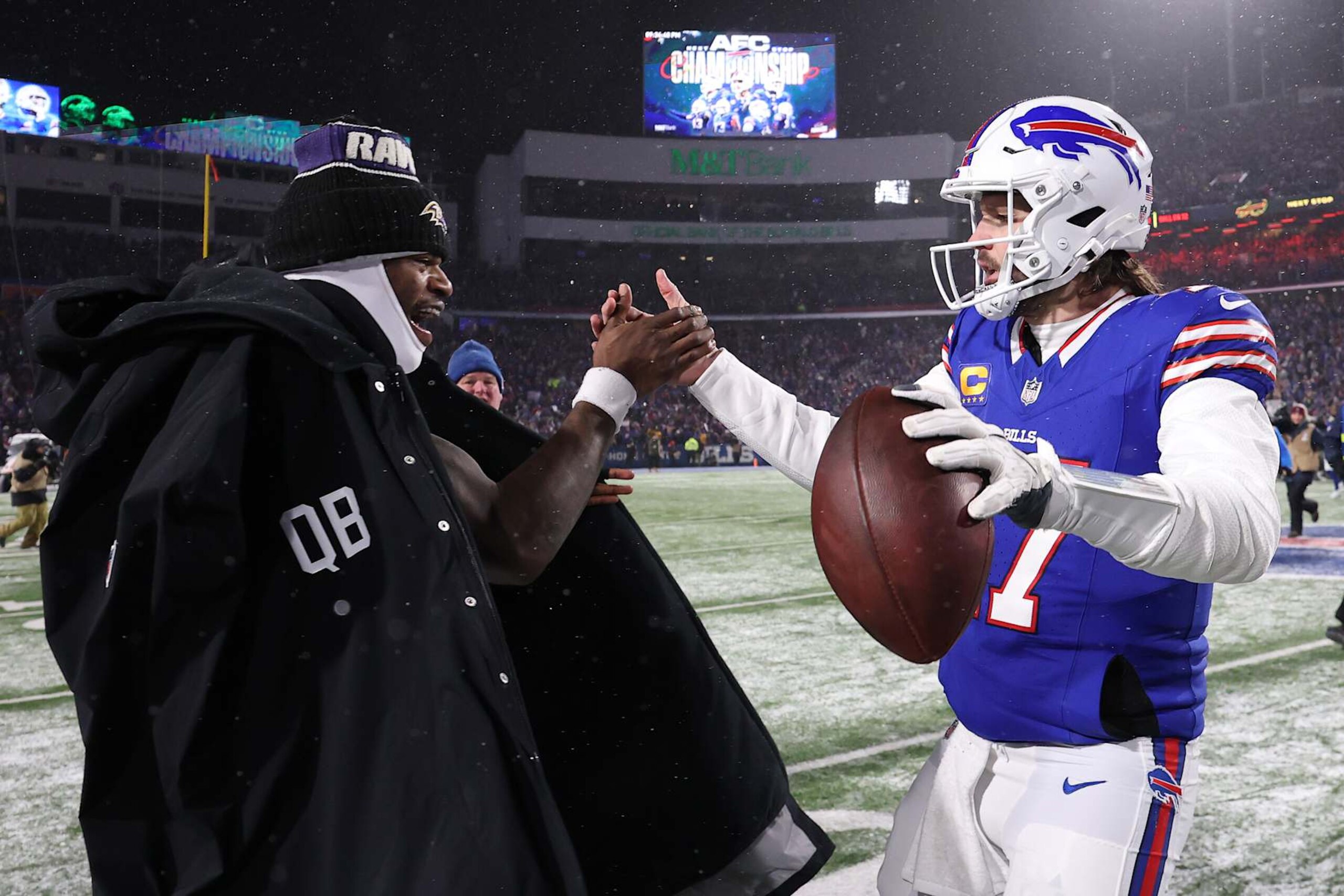 ORCHARD PARK, NEW YORK - JANUARY 19: Lamar Jackson #8 of the Baltimore Ravens and Josh Allen #17 of the Buffalo Bills embrace after the AFC Divisional Playoff game at Highmark Stadium on January 19, 2025 in Orchard Park, New York.  (Photo by Al Bello/Getty Images)