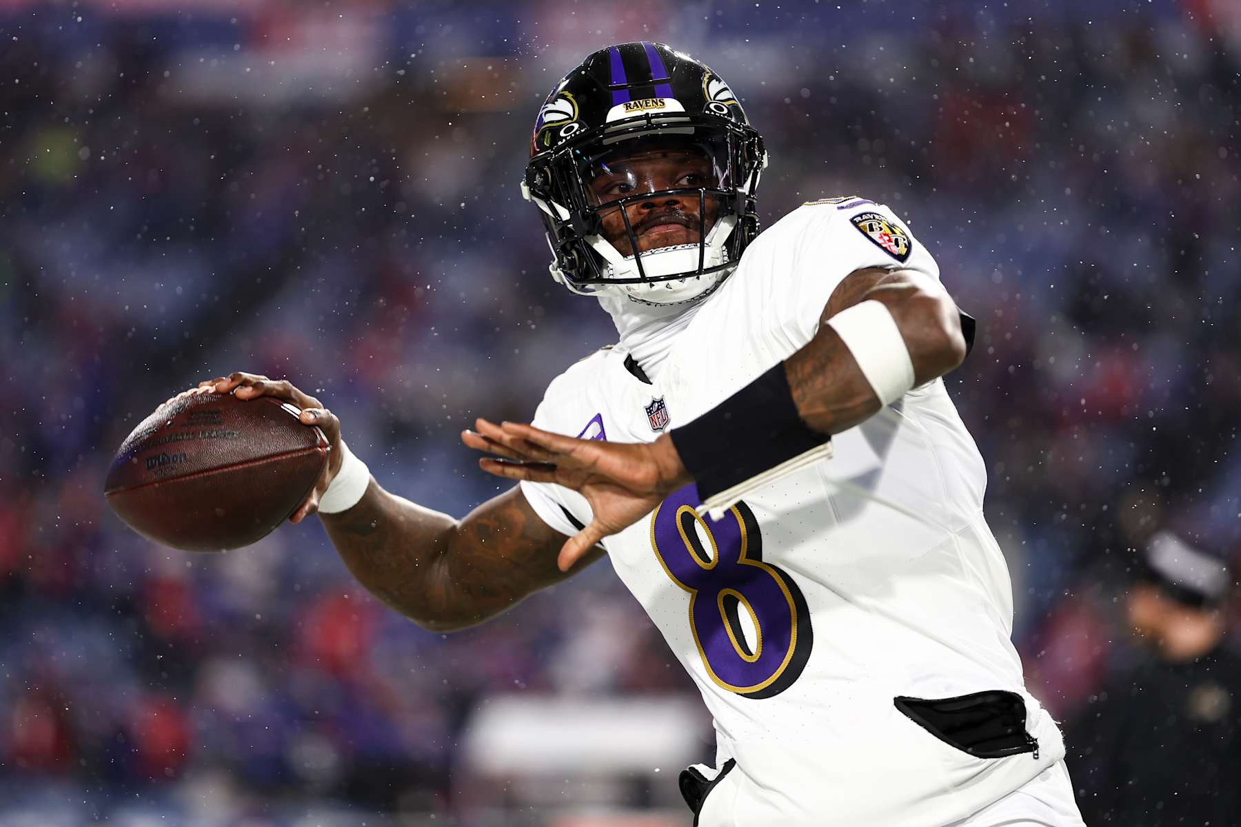 ORCHARD PARK, NEW YORK - JANUARY 19: Lamar Jackson #8 of the Baltimore Ravens warms up before an NFL football divisional playoff game against the Buffalo Bills at Highmark Stadium on January 19, 2025 in Orchard Park, New York. (Photo by Kevin Sabitus/Getty Images)