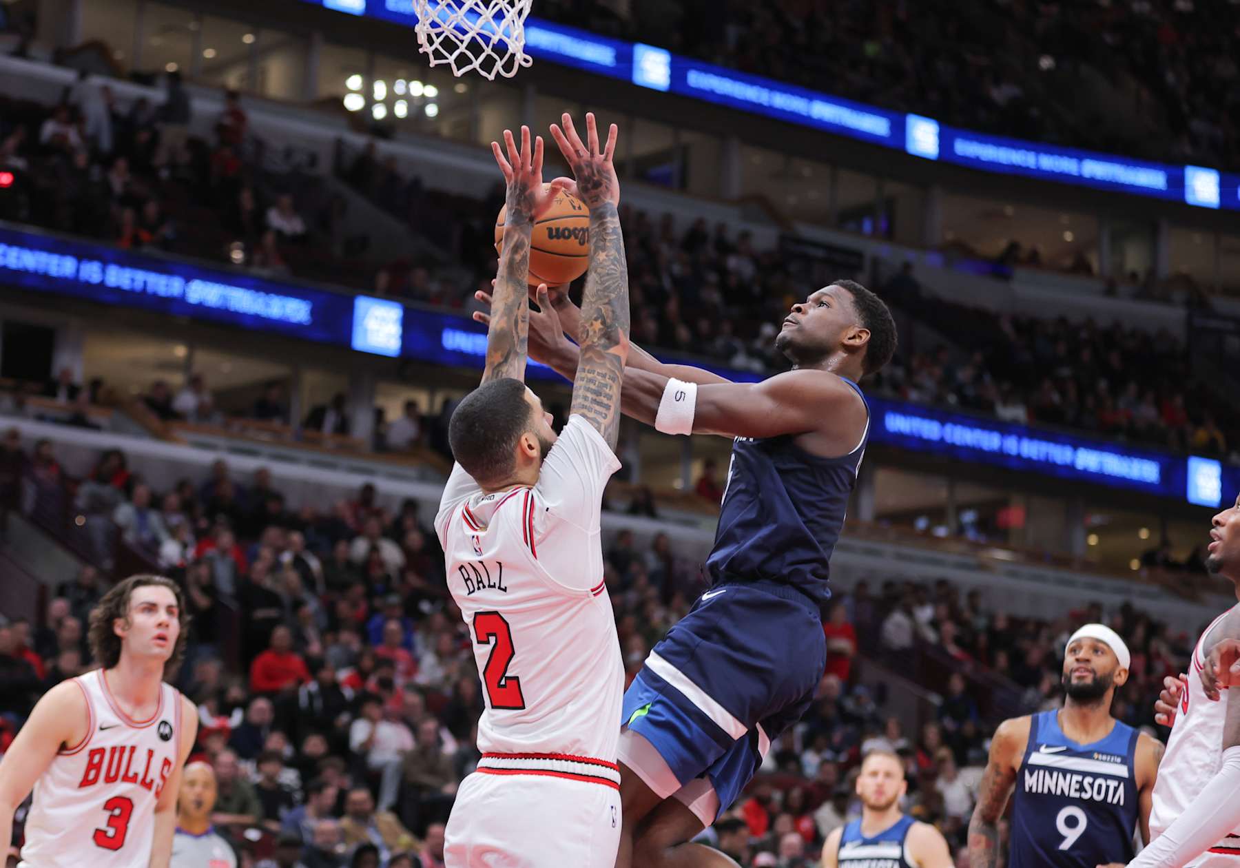 CHICAGO, IL - OCTOBER 16: Minnesota Timberwolves guard Anthony Edwards (5) drives to the basket for a layup against Chicago Bulls guard Lonzo Ball (2) during the first half of a preseason game on October 16, 2024 at the United Center in Chicago, Illinois. (Photo by Melissa Tamez/Icon Sportswire via Getty Images)