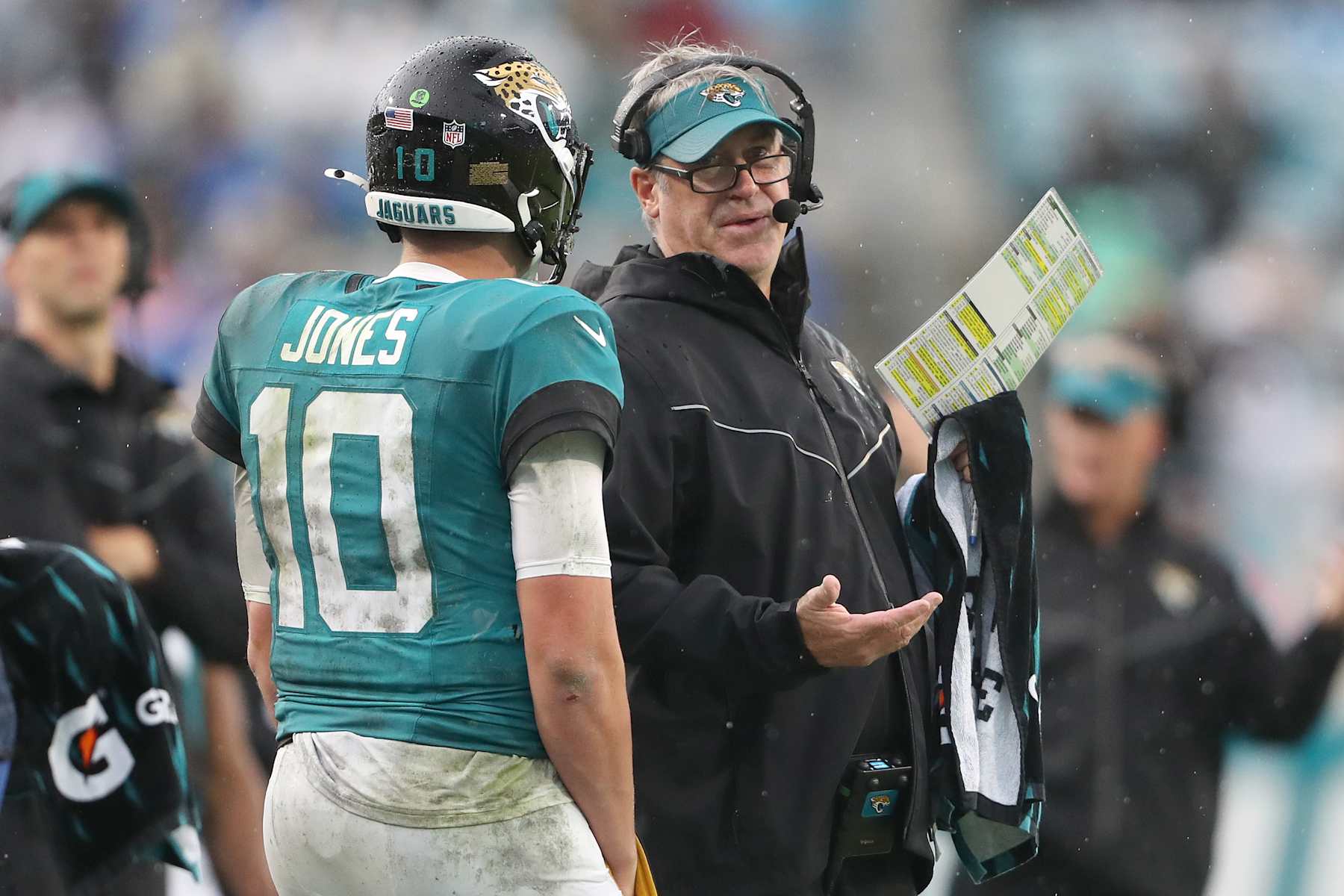 JACKSONVILLE, FLORIDA - DECEMBER 29: Jacksonville Jaguars head coach Doug Pederson speaks with Mac Jones #10 on the sideline during the first half against the Tennessee Titans at EverBank Stadium on December 29, 2024 in Jacksonville, Florida. (Photo by Courtney Culbreath/Getty Images)