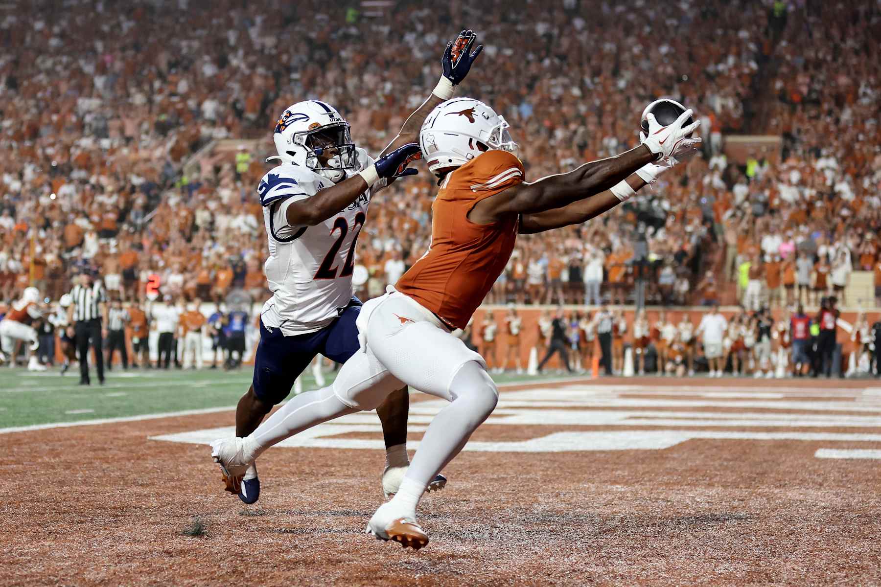 AUSTIN, TEXAS - SEPTEMBER 14: Johntay Cook II #1 of the Texas Longhorns catches a pass for a touchdown while defended by Elijah Newell #22 of the UTSA Roadrunners in the second half at Darrell K Royal-Texas Memorial Stadium on September 14, 2024 in Austin, Texas. (Photo by Tim Warner/Getty Images)