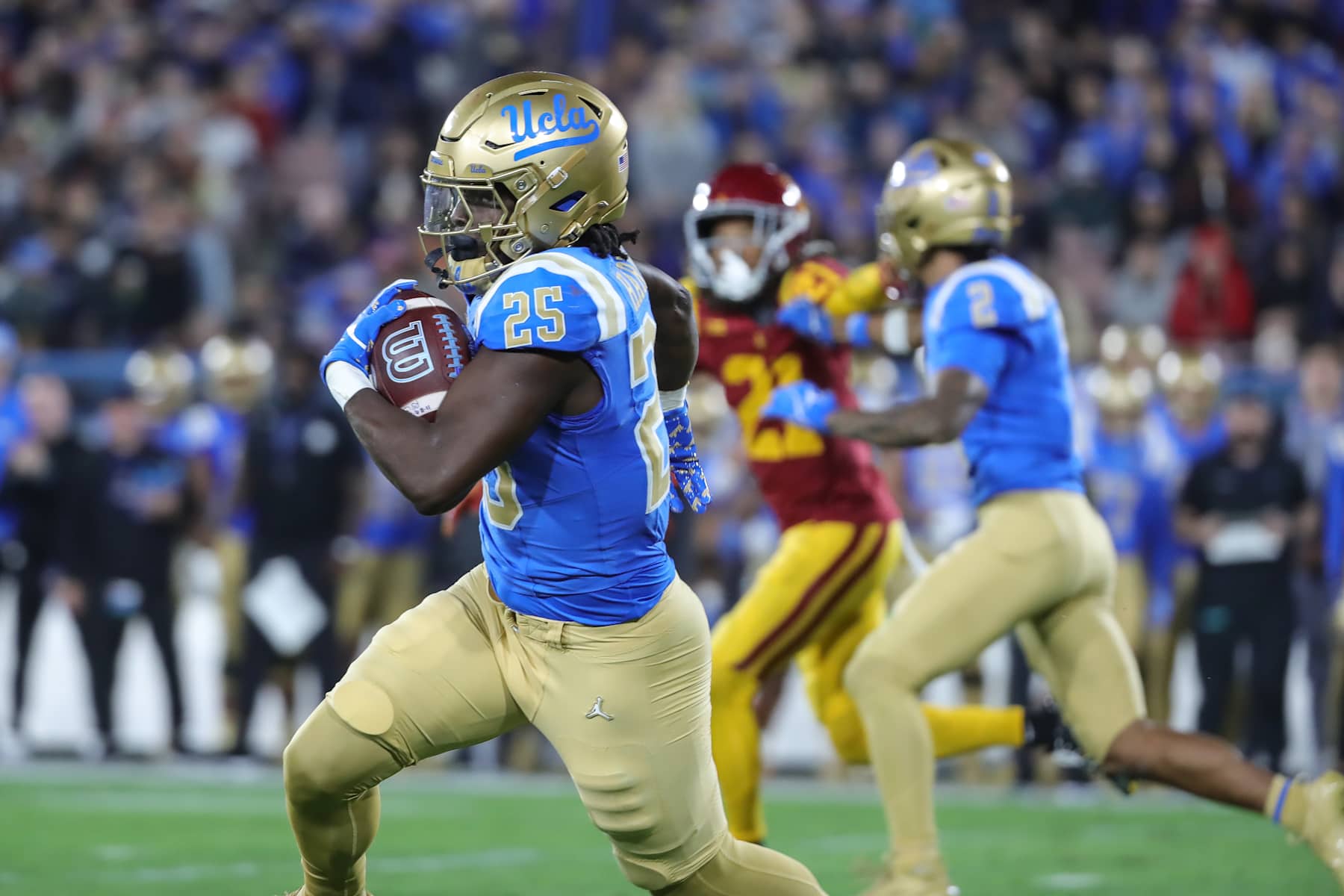 PASADENA, CA - NOVEMBER 23: UCLA Bruins running back T.J. Harden (25) runs the football during the college football game between the USC Trojans and the UCLA Bruins on November 23, 2024, at the Rose Bowl in Pasadena, CA. (Photo by Jevone Moore/Icon Sportswire via Getty Images)