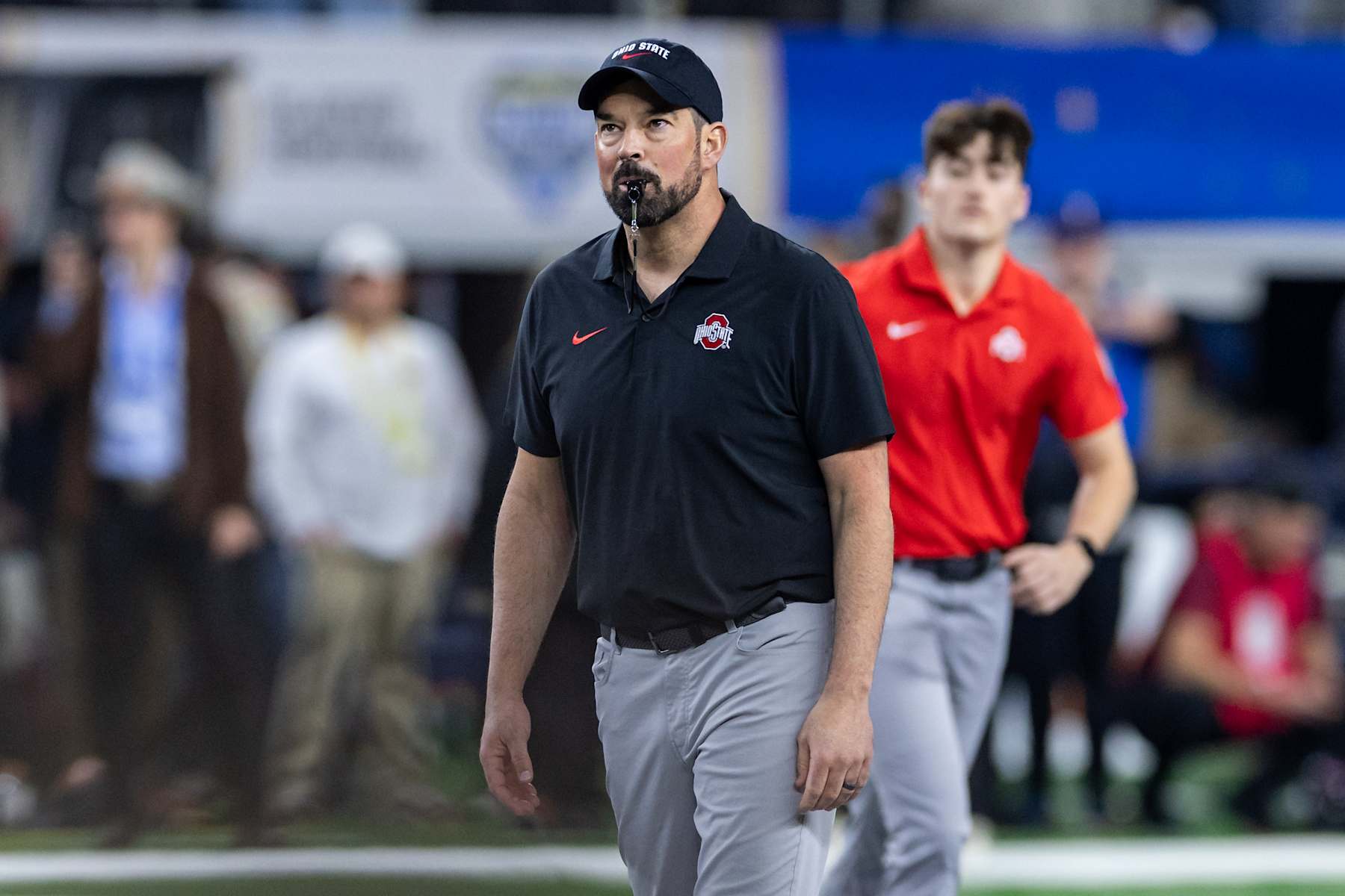 ARLINGTON, TX - JANUARY 10: Ohio State Buckeyes head coach Ryan Day looks on during warm-ups during the CFP Semifinal Cotton Bowl Classic football game between the Ohio State Buckeyes and Texas Longhorns on January 10, 2025 at AT&T Stadium in Arlington, TX.  (Photo by Matthew Visinsky/Icon Sportswire via Getty Images)