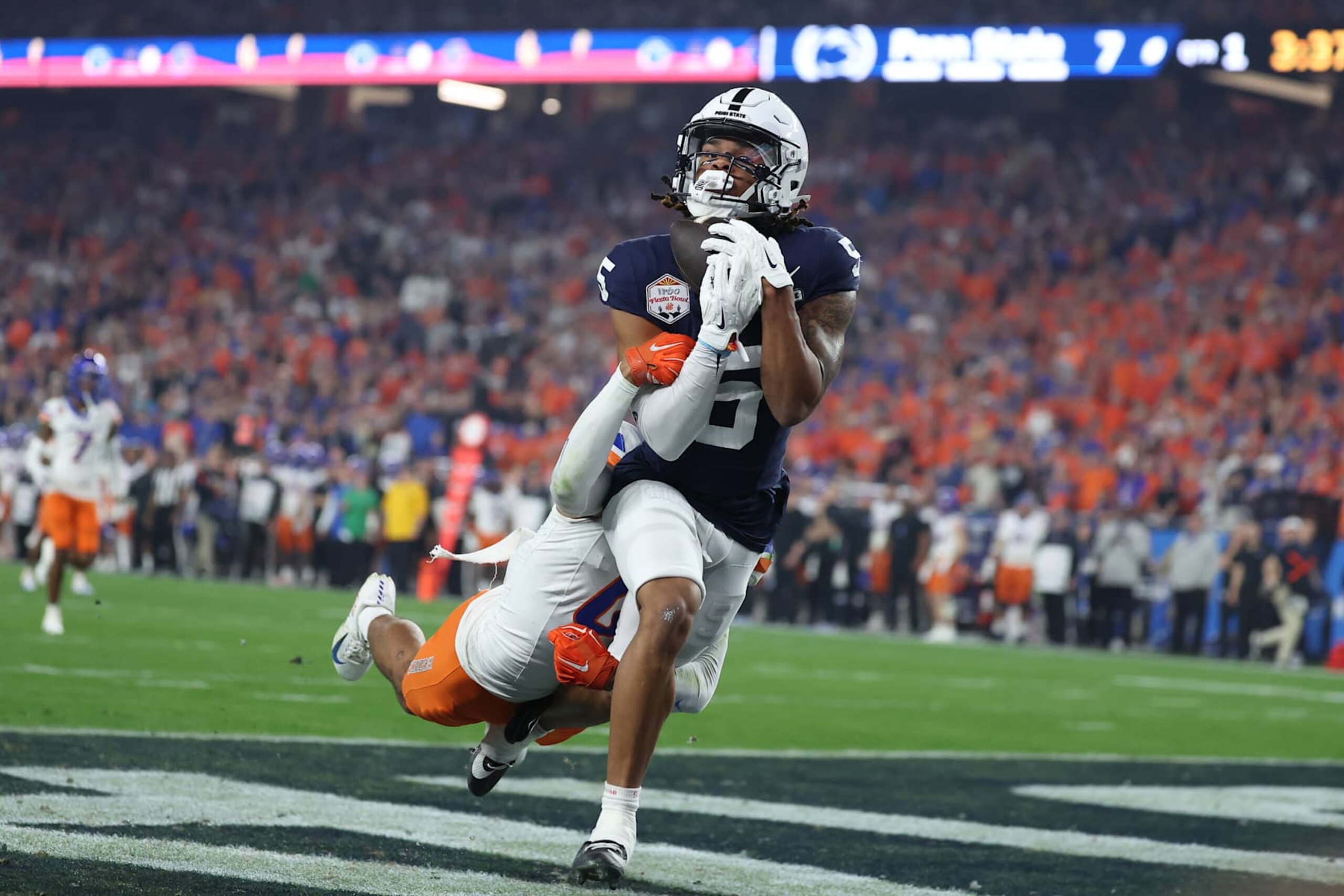 GLENDALE, ARIZONA - DECEMBER 31: Omari Evans #5 of the Penn State Nittany Lions catches a pass for a touchdown during the first quarter against the Boise State Broncos in the 2024 Vrbo Fiesta Bowl at State Farm Stadium on December 31, 2024 in Glendale, Arizona. (Photo by Chris Coduto/Getty Images) GLENDALE, ARIZONA - DECEMBER 31: Omari Evans #5 of the Penn State Nittany Lions catches a pass for a touchdown during the first quarter against the Boise State Broncos in the 2024 Vrbo Fiesta Bowl at State Farm Stadium on December 31, 2024 in Glendale, Arizona. (Photo by Chris Coduto/Getty Images)