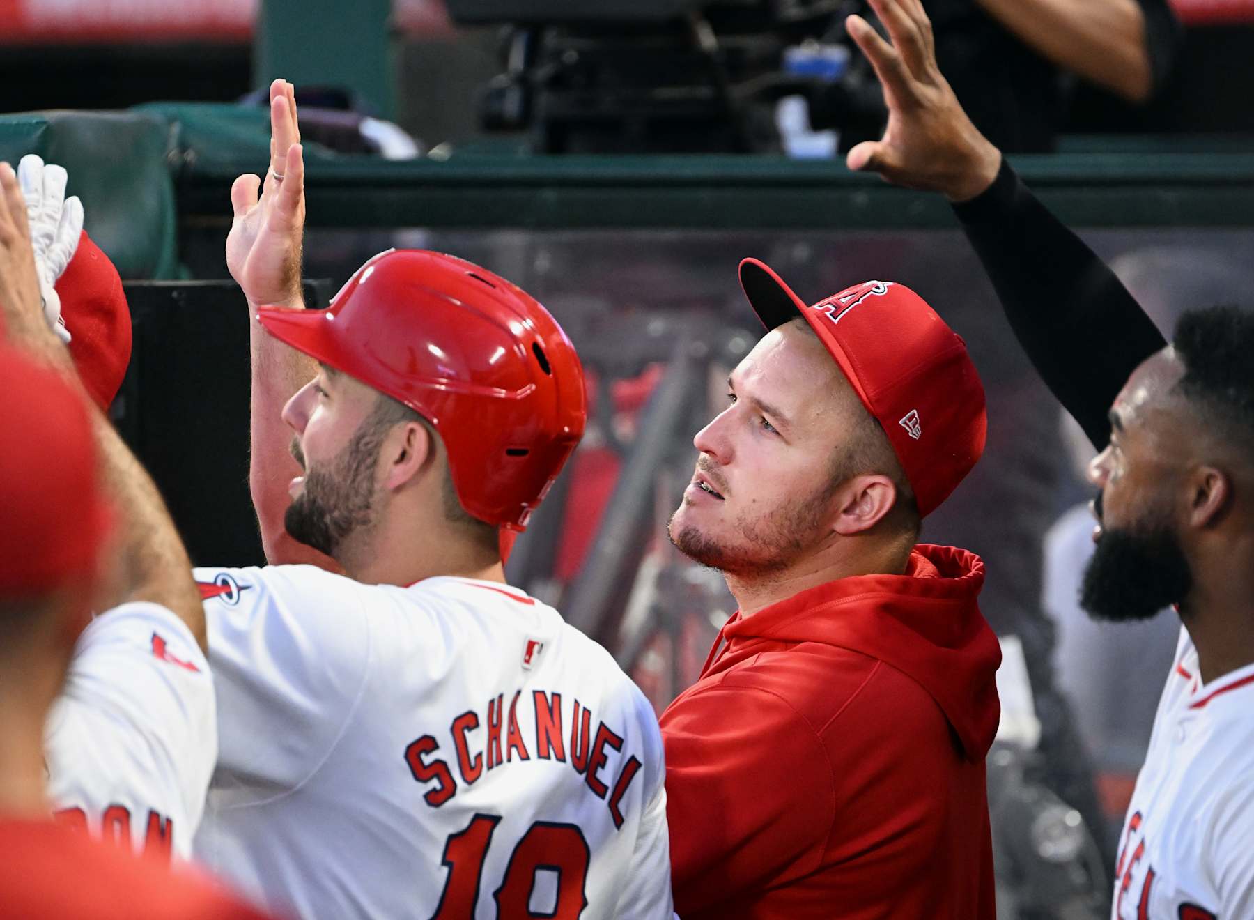 ANAHEIM, CA - SEPTEMBER 04: Los Angeles Angels out fielder Mike Trout (27) waits for Mickey Moniak (16) in the dugout after Moniak hit a three run home run during the first inning of an MLB baseball game against the Los Angeles Dodgers played on September 4, 2024 at Angel Stadium in Anaheim, CA. (Photo by John Cordes/Icon Sportswire via Getty Images)