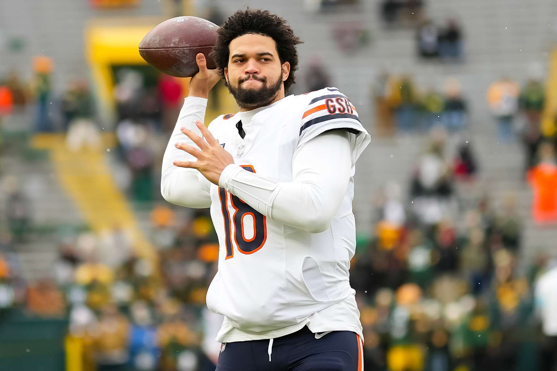 GREEN BAY, WISCONSIN - JANUARY 5: Quarterback Caleb Williams #18 of the Chicago Bears warms up prior to an NFL football game against the Green Bay Packers, at Lambeau Field on January 5, 2025 in Green Bay, Wisconsin. (Photo by Todd Rosenberg/Getty Images)