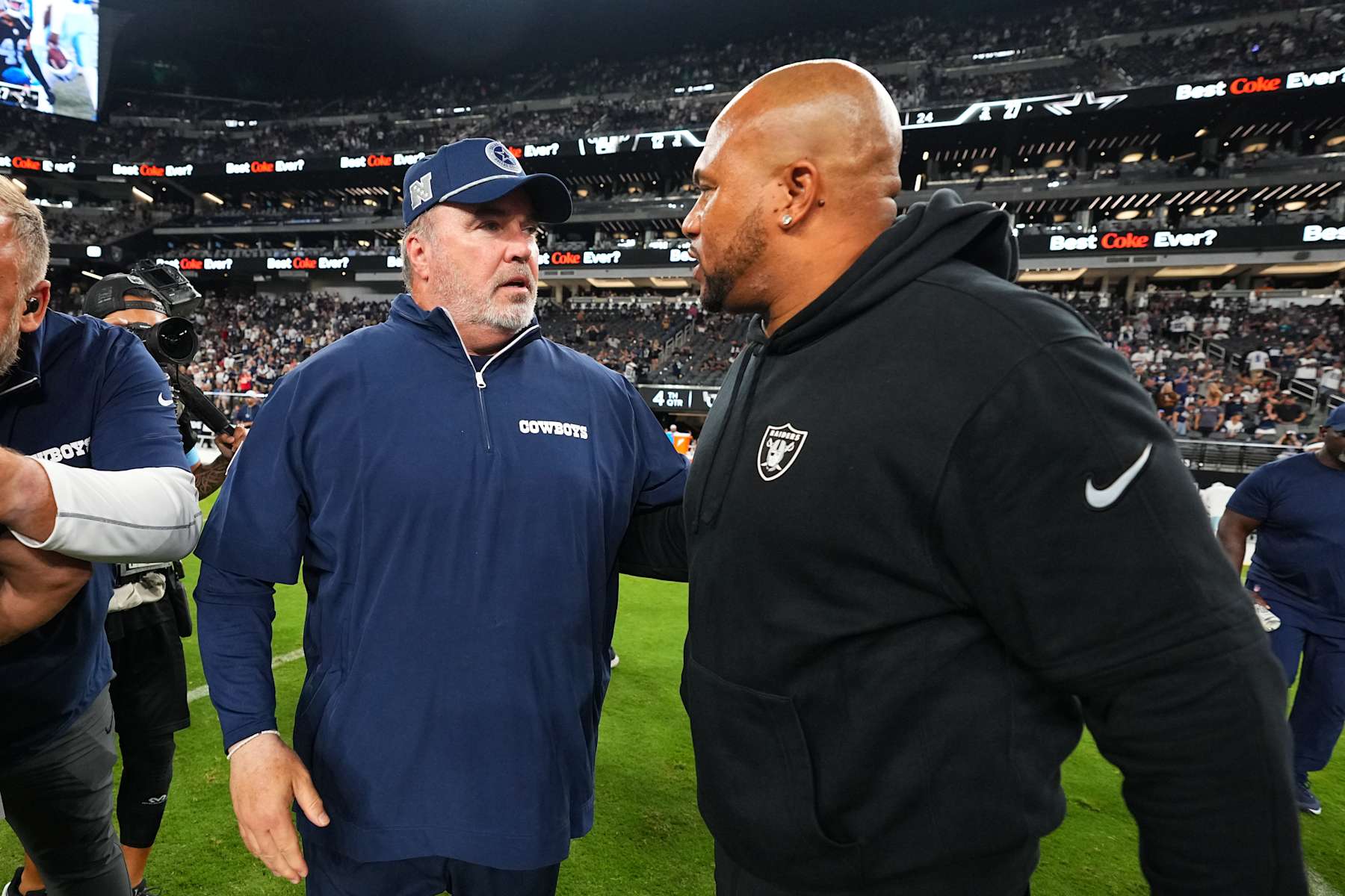 LAS VEGAS, NEVADA - AUGUST 17:  (L-R) Head coach Mike McCarthy of the Dallas Cowboys speaks to head coach Antonio Pierce of the Las Vegas Raiders after a preseason game at Allegiant Stadium on August 17, 2024 in Las Vegas, Nevada. The Cowboys defeated the Raiders 27-12. (Photo by Chris Unger/Getty Images)
