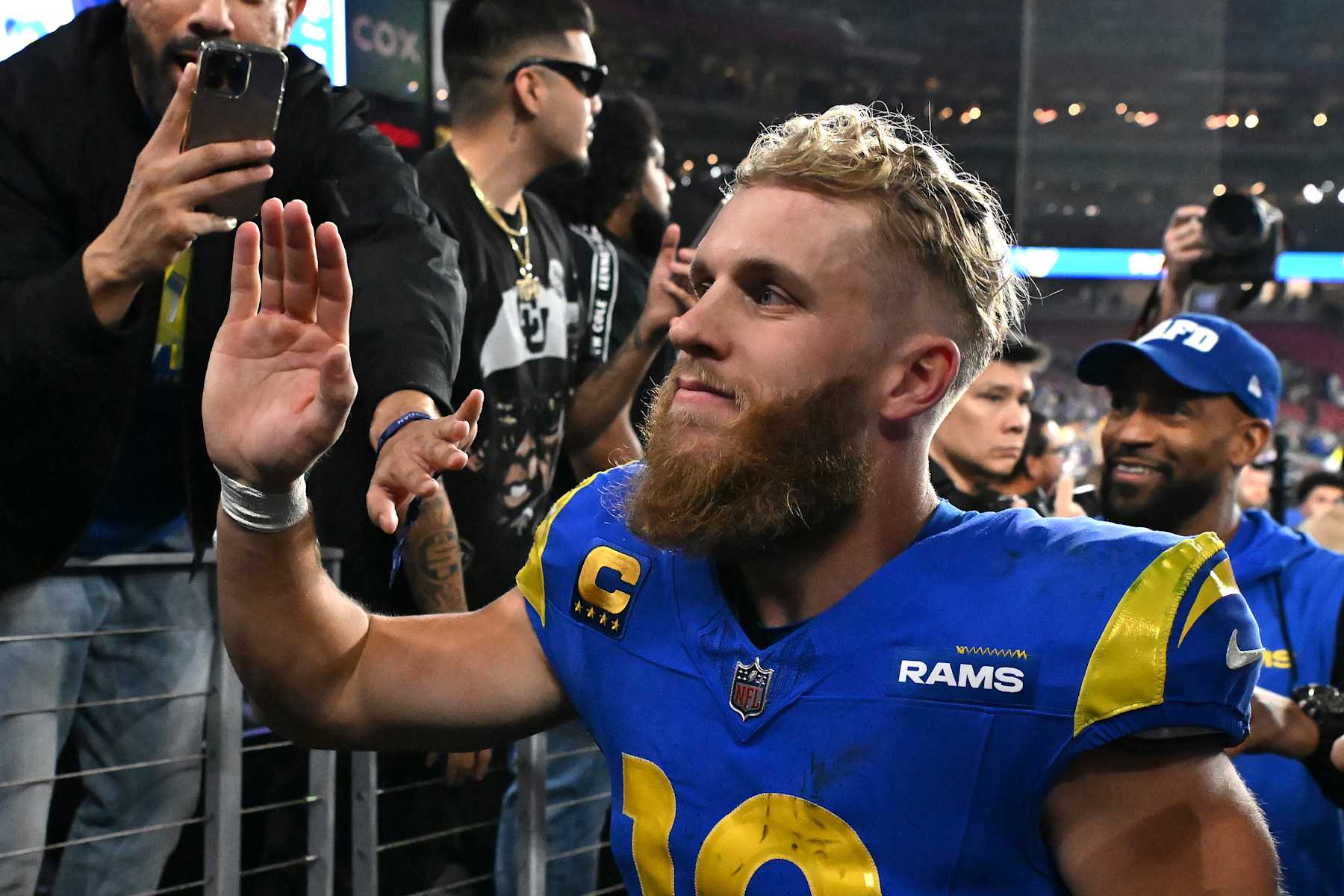 GLENDALE, ARIZONA - JANUARY 13: Cooper Kupp #10 of the Los Angeles Rams celebrates with fans after a win over the Minnesota Vikings during the NFC Wild Card Playoff at State Farm Stadium on January 13, 2025 in Glendale, Arizona.  (Photo by Norm Hall/Getty Images)