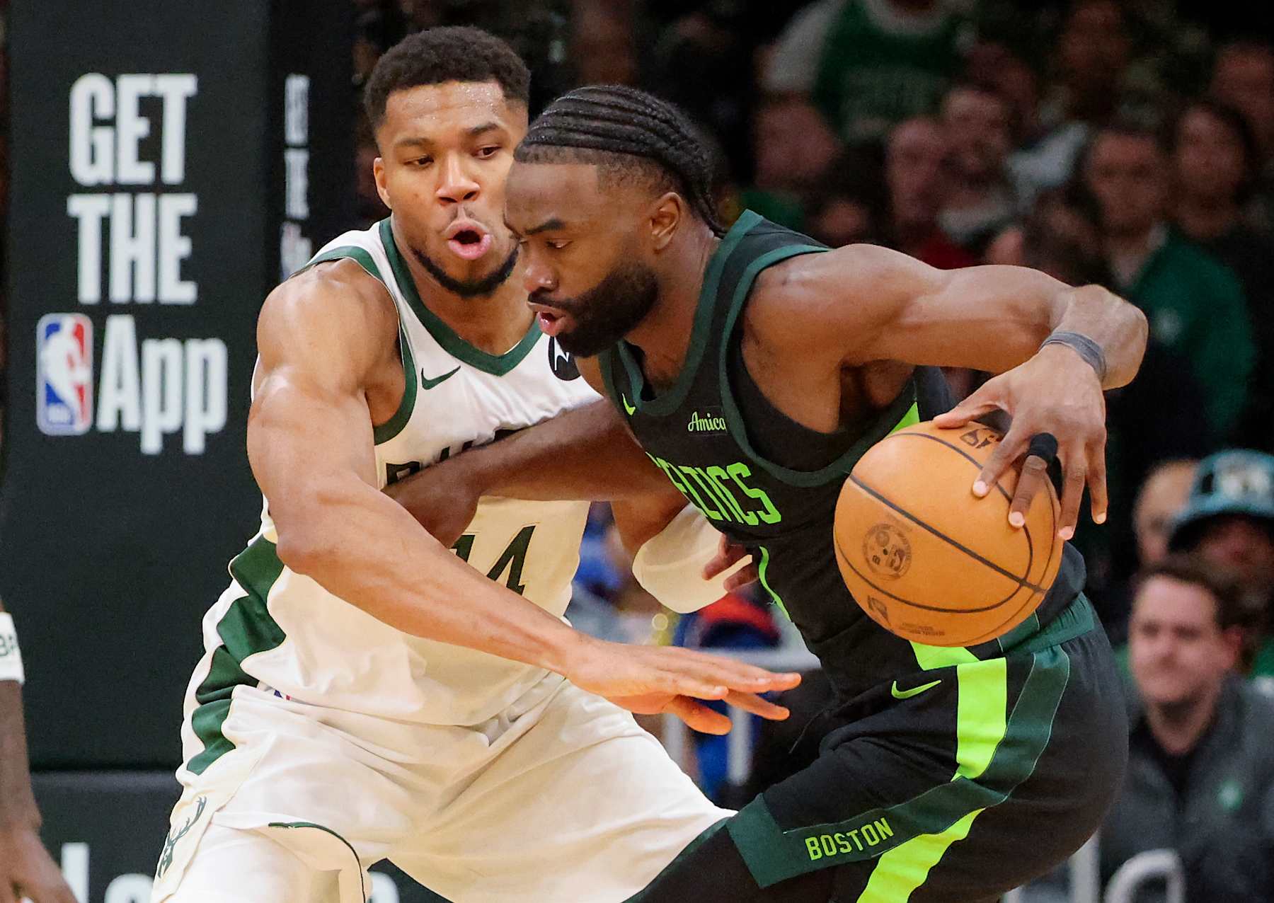 Boston, MA - December 6: Boston Celtics SG Jaylen Brown is defended by Milwaukee Bucks C Giannis Antetokounmpo in the third quarter. (Photo by Matthew J. Lee/The Boston Globe via Getty Images)