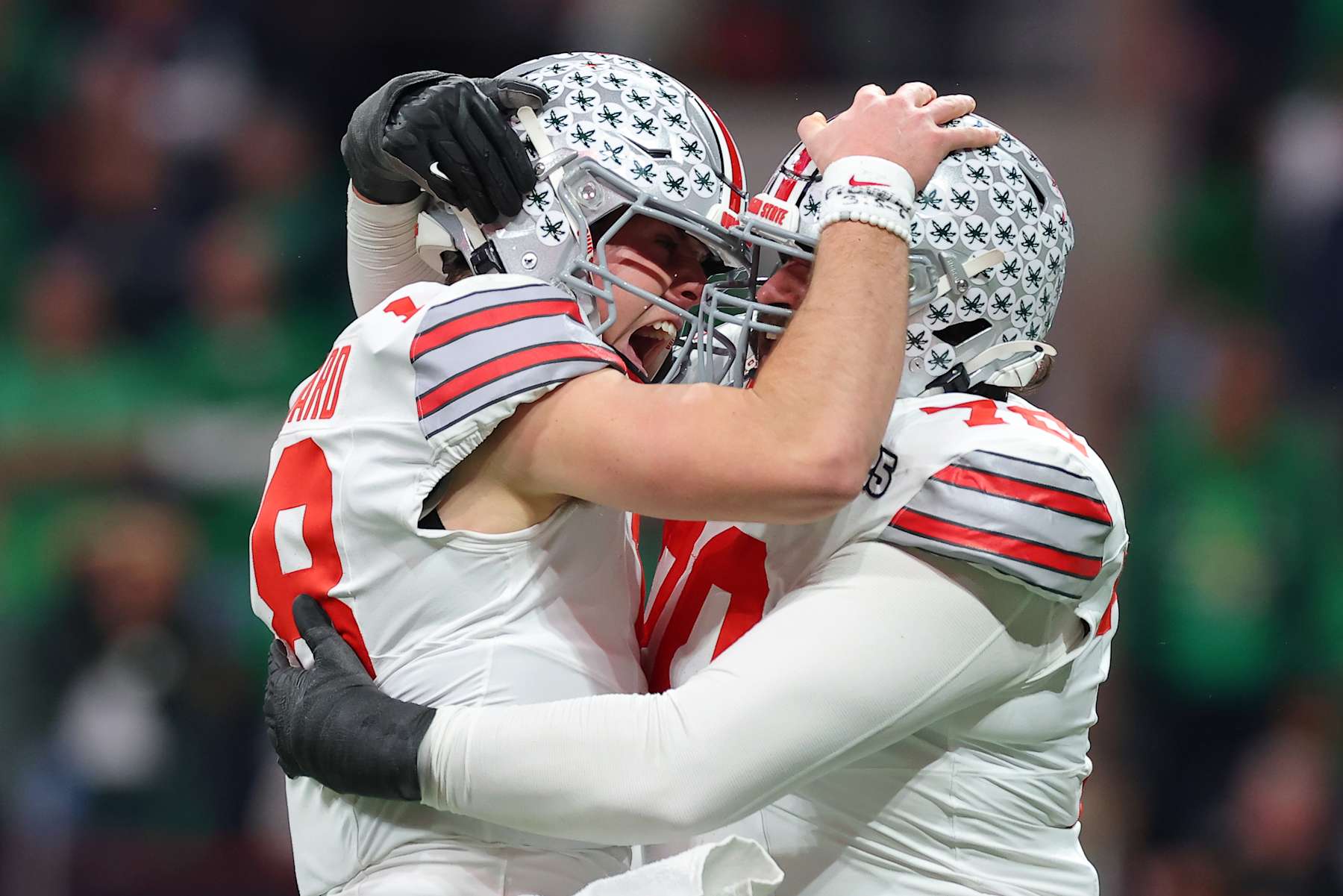ATLANTA, GEORGIA - JANUARY 20: Will Howard #18 celebrates a touchdown with Josh Fryar #70 of the Ohio State Buckeyes against the Notre Dame Fighting Irish during the second quarter in the 2025 CFP National Championship at the Mercedes-Benz Stadium on January 20, 2025 in Atlanta, Georgia. (Photo by Kevin C. Cox/Getty Images)