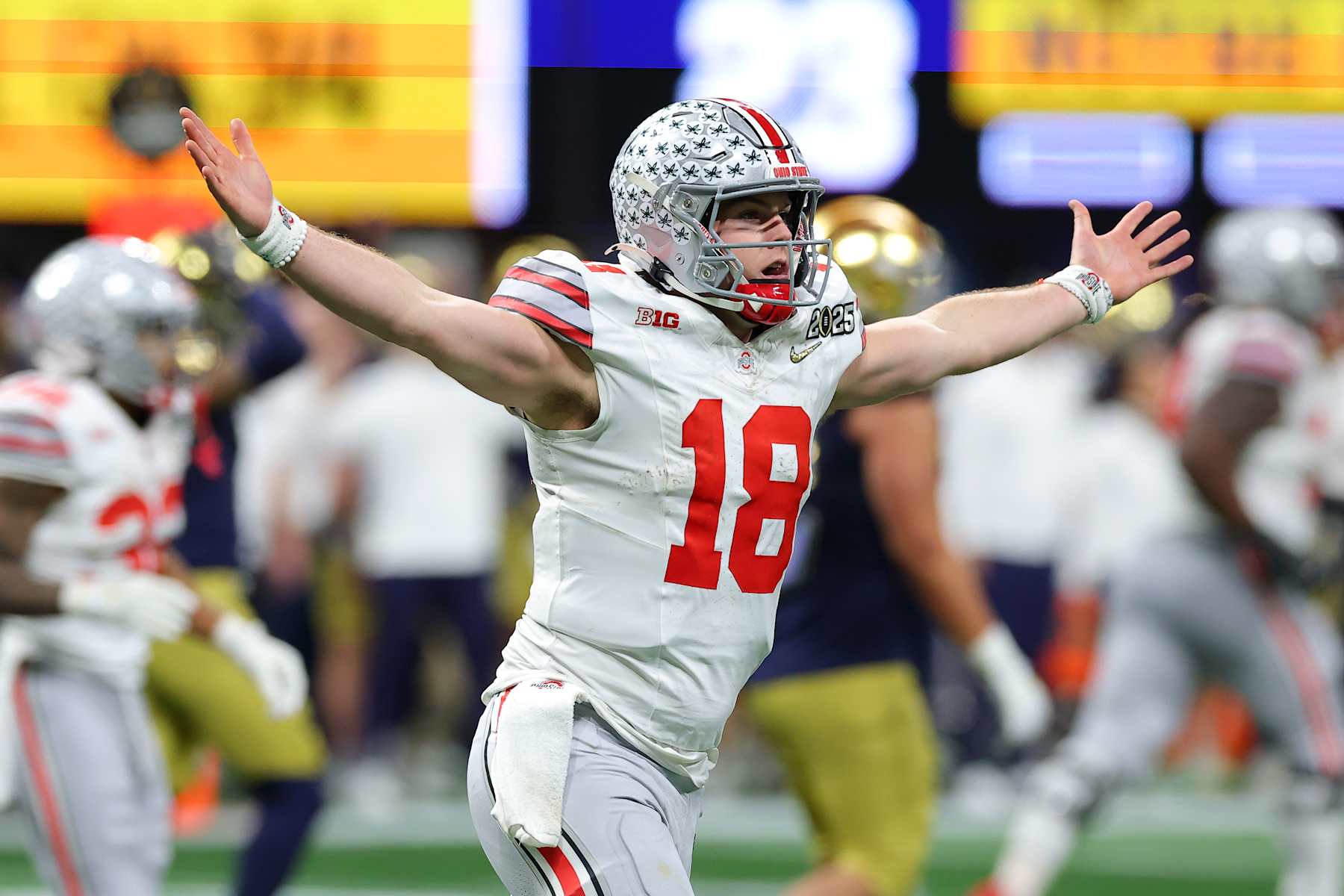 ATLANTA, GEORGIA - JANUARY 20: Will Howard #18 of the Ohio State Buckeyes reacts after throwing a pass for a first down against the Notre Dame Fighting Irish during the fourth quarter in the 2025 CFP National Championship at the Mercedes-Benz Stadium on January 20, 2025 in Atlanta, Georgia. (Photo by Kevin C. Cox/Getty Images)