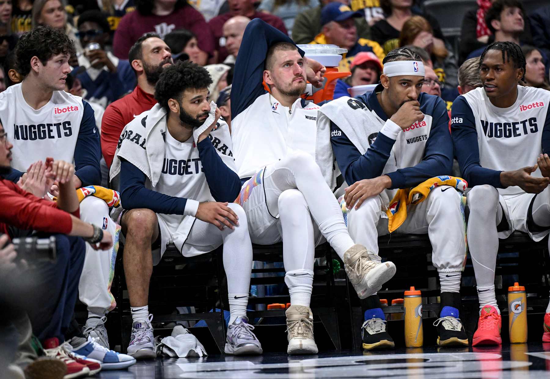 DENVER, CO - NOVEMBER 25: Jamal Murray (27) and Nikola Jokic (15) of the Denver Nuggets sit on the bench with teammates during the fourth quarter of the New York Knicks' 145-118 win at Ball Arena in Denver, Colorado on Monday, November 25, 2024. (Photo by AAron Ontiveroz/The Denver Post)