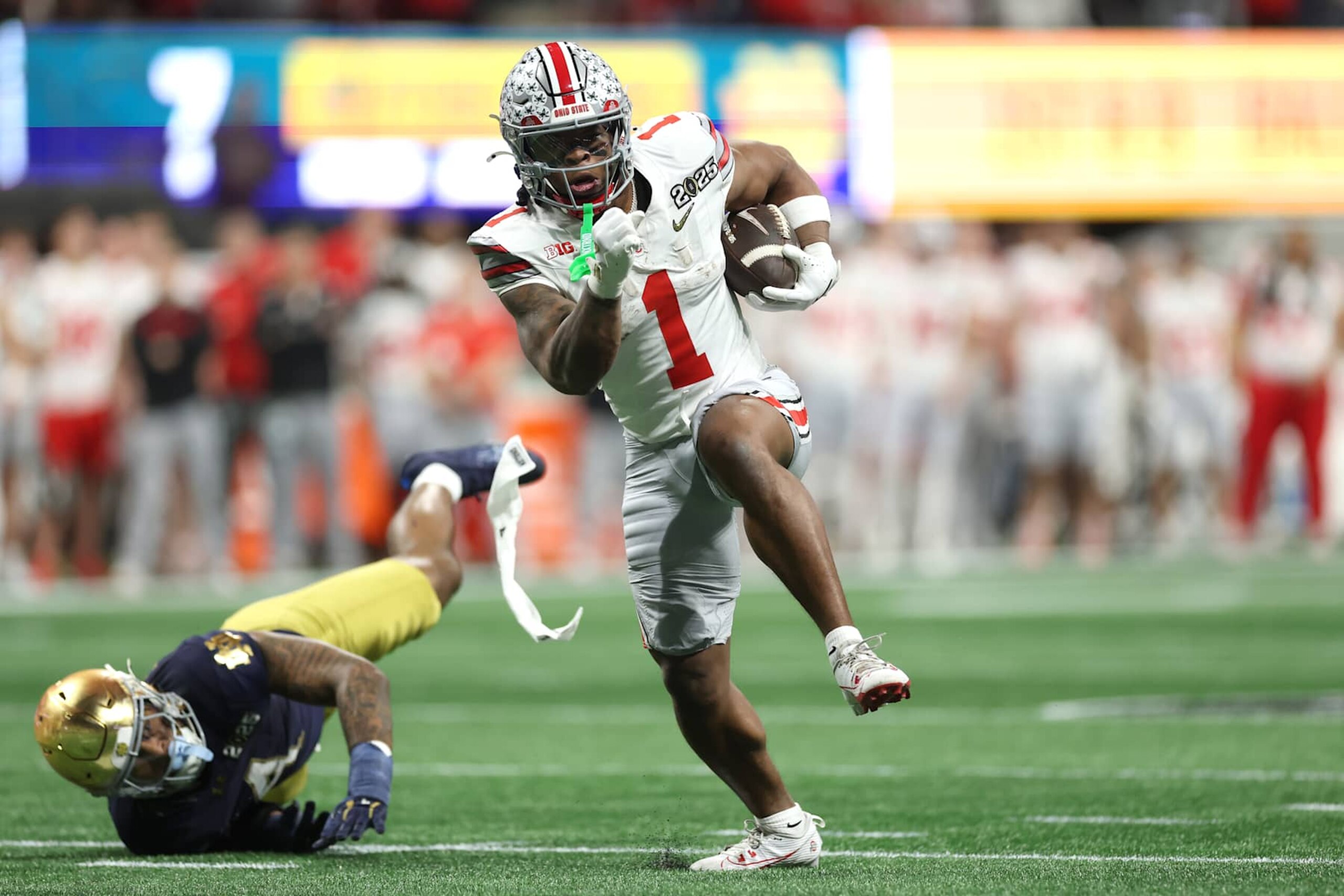 ATLANTA, GEORGIA - JANUARY 20: Quinshon Judkins #1 of the Ohio State Buckeyes runs for a touchdown against the Notre Dame Fighting Irish during the second quarter in the 2025 CFP National Championship at the Mercedes-Benz Stadium on January 20, 2025 in Atlanta, Georgia. (Photo by Jamie Squire/Getty Images) ATLANTA, GEORGIA - JANUARY 20: Quinshon Judkins #1 of the Ohio State Buckeyes runs for a touchdown against the Notre Dame Fighting Irish during the second quarter in the 2025 CFP National Championship at the Mercedes-Benz Stadium on January 20, 2025 in Atlanta, Georgia. (Photo by Jamie Squire/Getty Images)