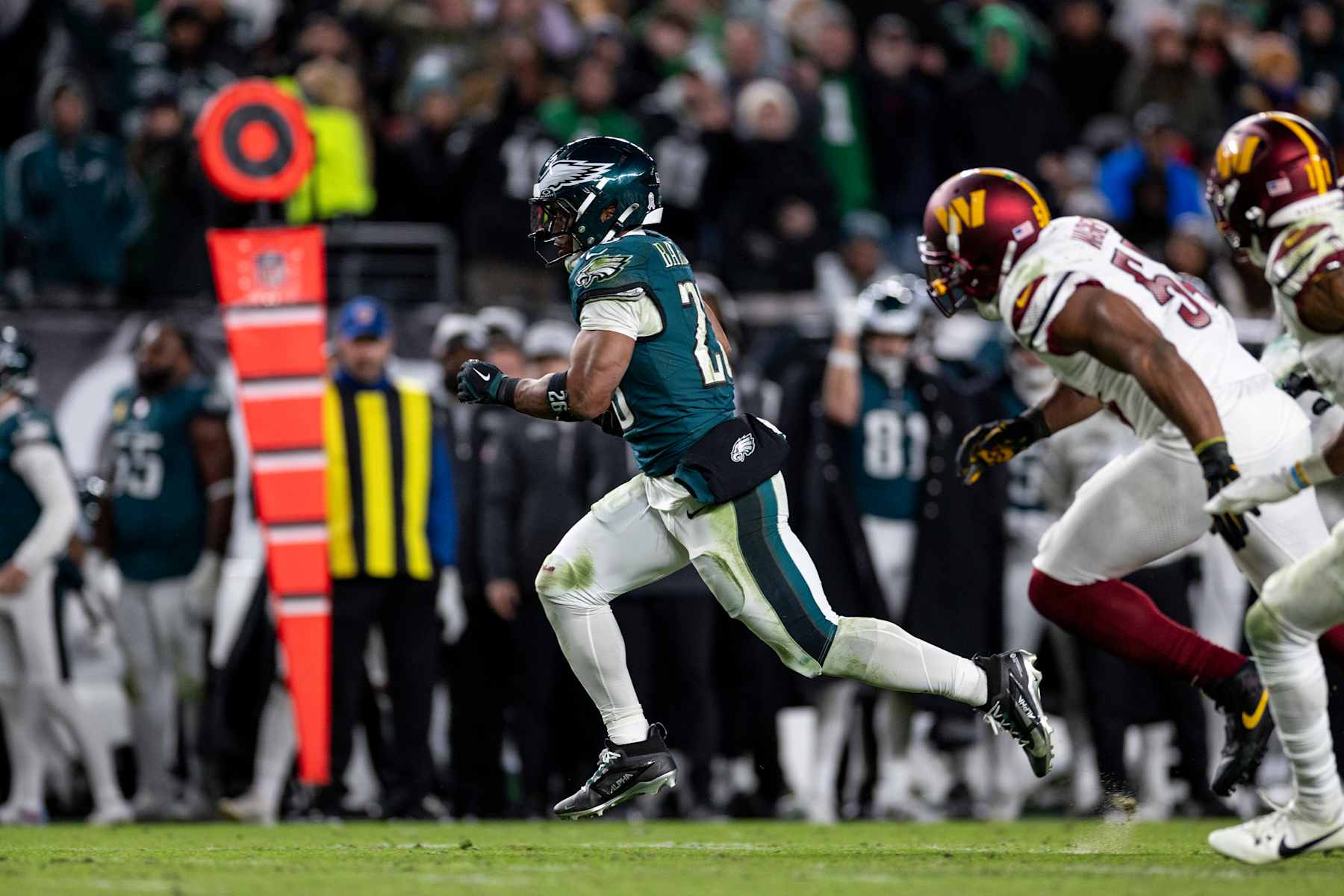 PHILADELPHIA, PENNSYLVANIA - NOVEMBER 14: Saquon Barkley #26 of the Philadelphia Eagles runs with the ball and scores a touchdown during an NFL Football game against the Washington Commanders at Lincoln Financial Field on November 14, 2024 in Philadelphia, Pennsylvania. (Photo by Michael Owens/Getty Images)