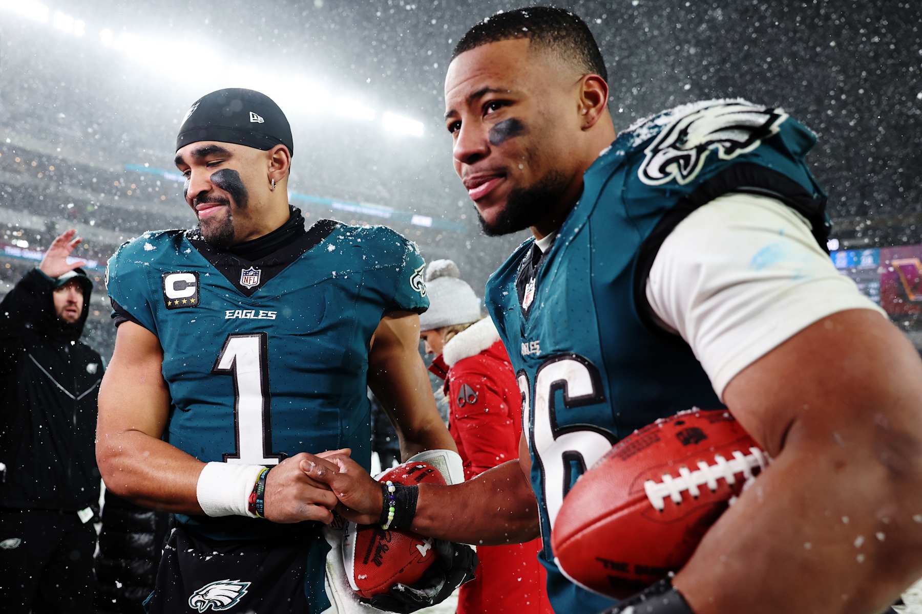 PHILADELPHIA, PENNSYLVANIA - JANUARY 19: (L-R) Jalen Hurts #1 and Saquon Barkley #26 of the Philadelphia Eagles react after defeating the Los Angeles Rams 28-22 in the NFC Divisional Playoff at Lincoln Financial Field on January 19, 2025 in Philadelphia, Pennsylvania. (Photo by Sarah Stier/Getty Images)
