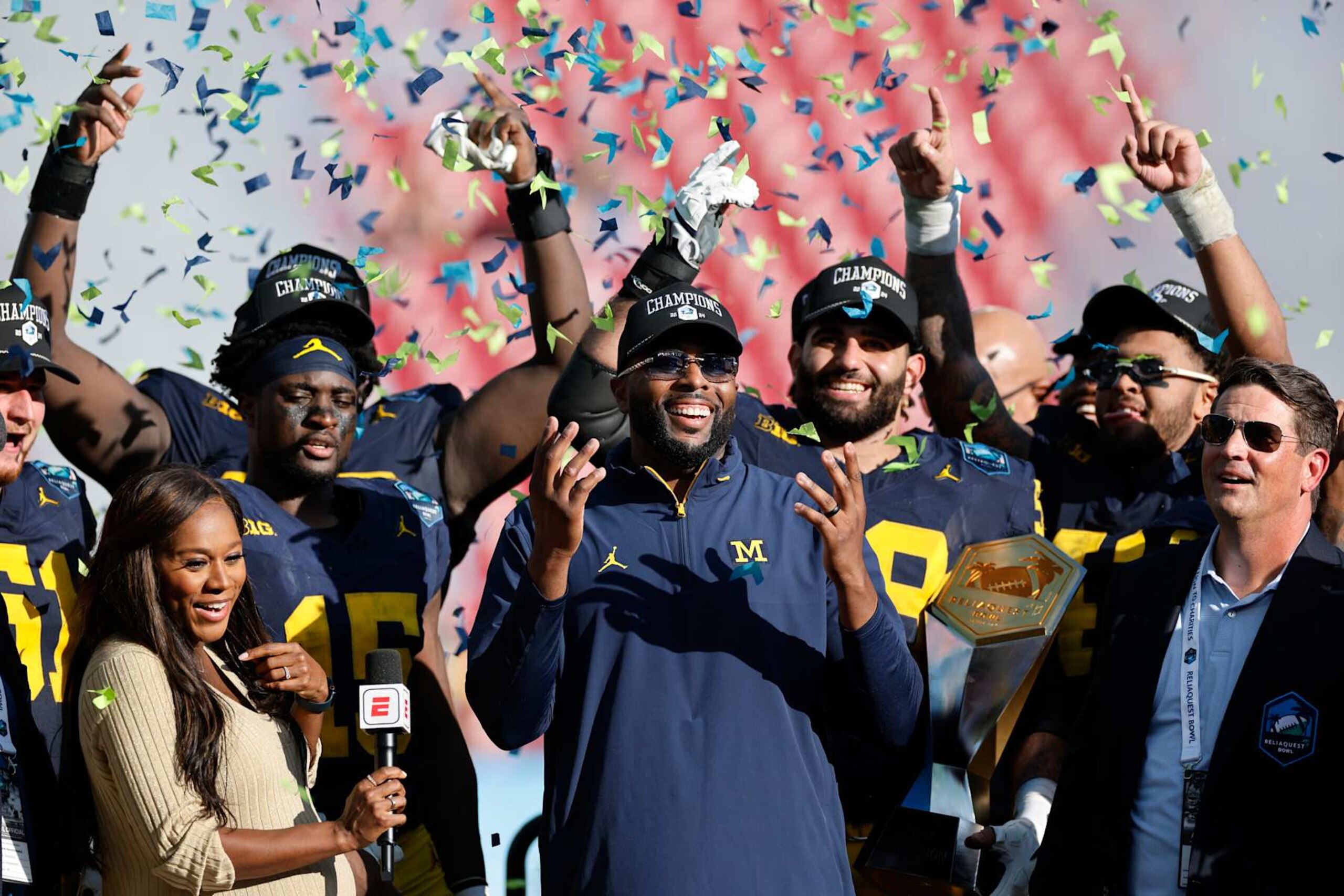 TAMPA, FL - DECEMBER 31: Michigan Wolverines head coach Sherrone Moore celebrates with his team after winning the ReliaQuest Bowl against the Alabama Crimson Tide on December 31, 2024 at Raymond James Stadium in Tampa, Florida. (Photo by Joe Robbins/Icon Sportswire via Getty Images)