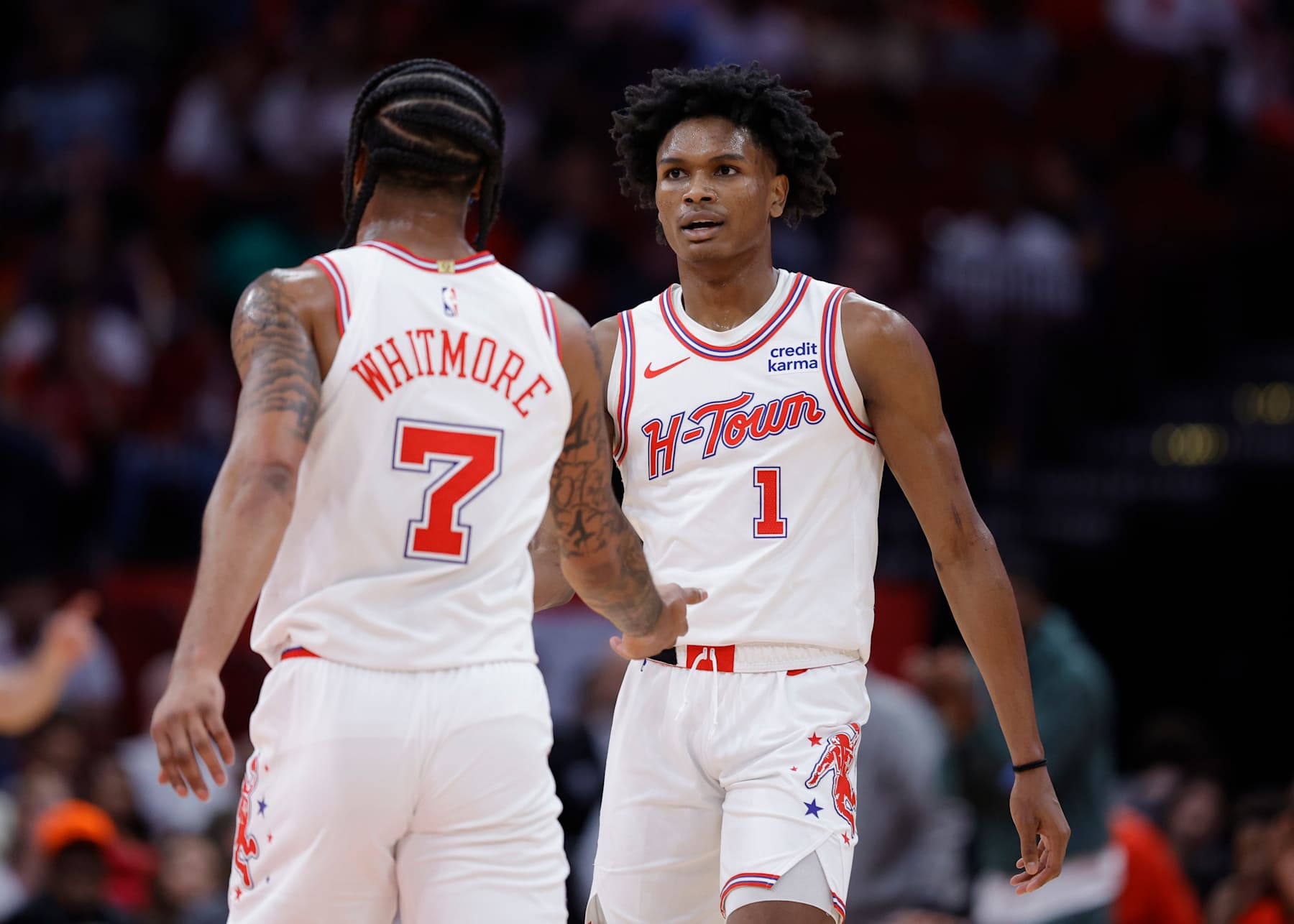 HOUSTON, TEXAS - FEBRUARY 25: Amen Thompson #1 of the Houston Rockets high fives Cam Whitmore #7 of the Houston Rockets against the Oklahoma City Thunder during the first half at Toyota Center on February 25, 2024 in Houston, Texas. NOTE TO USER: User expressly acknowledges and agrees that, by downloading and or using this photograph, User is consenting to the terms and conditions of the Getty Images License Agreement. (Photo by Carmen Mandato/Getty Images)