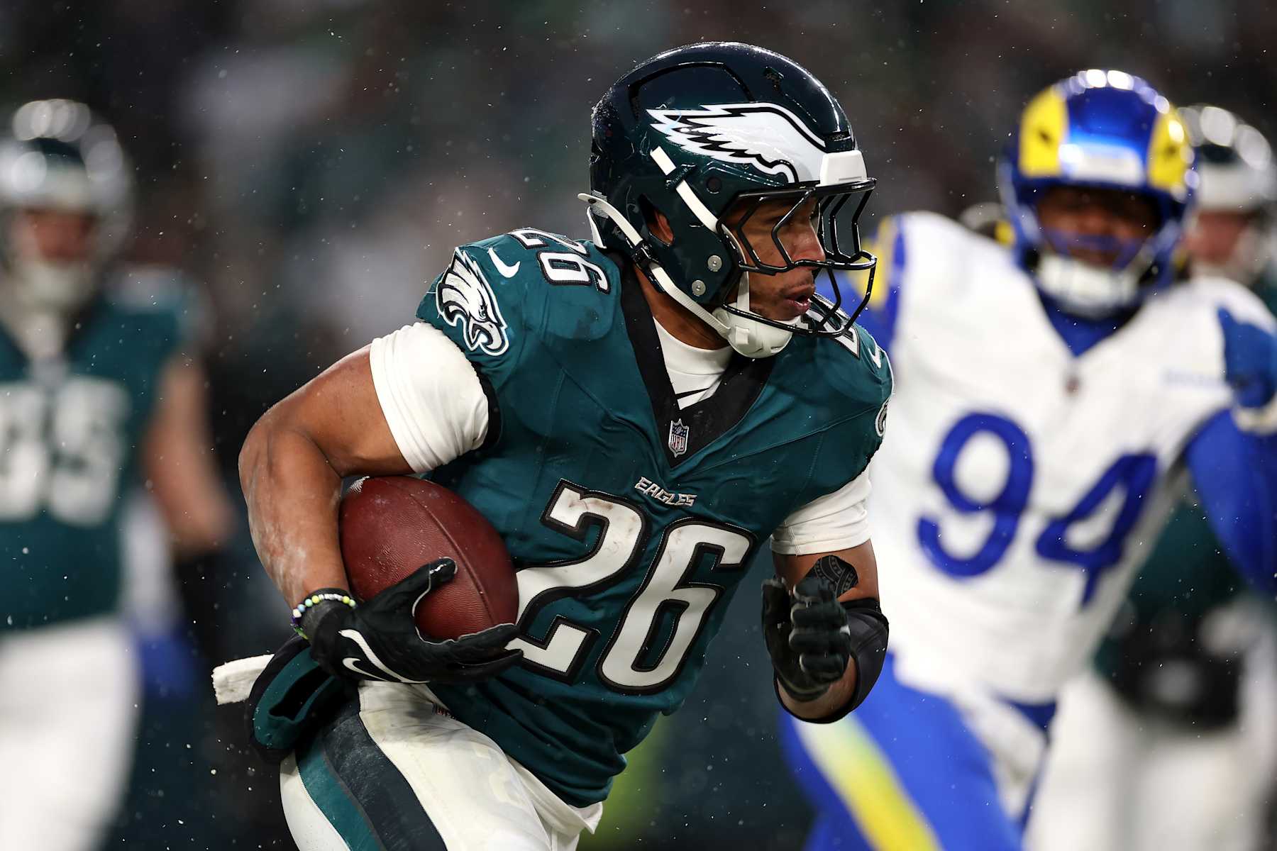 PHILADELPHIA, PENNSYLVANIA - JANUARY 19: Saquon Barkley #26 of the Philadelphia Eagles runs the ball against the Los Angeles Rams during the second quarter in the NFC Divisional Playoff at Lincoln Financial Field on January 19, 2025 in Philadelphia, Pennsylvania. (Photo by Sarah Stier/Getty Images)