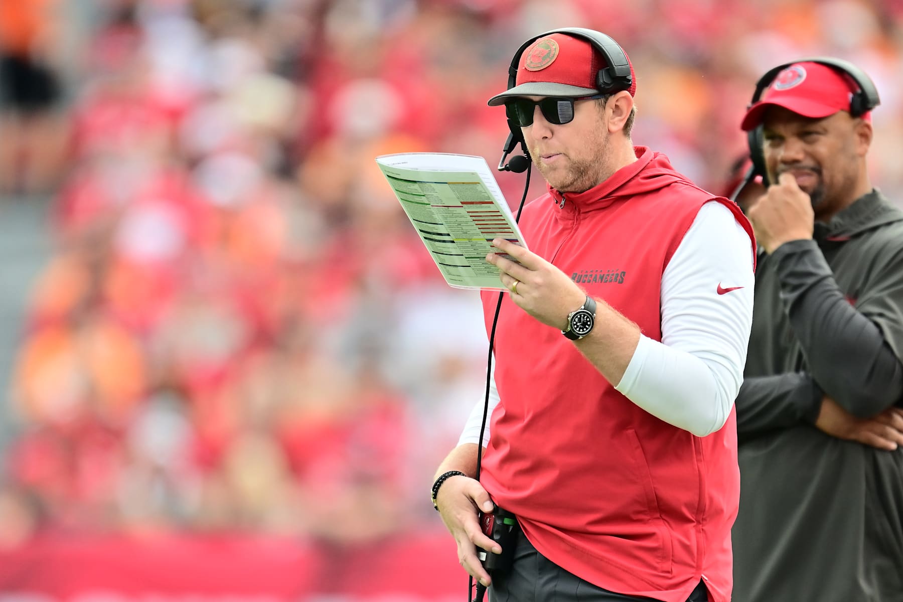 TAMPA, FLORIDA - DECEMBER 29: Liam Coen offensive coordinator of the Tampa Bay Buccaneers looks on during the first quarter against the Carolina Panthers at Raymond James Stadium on December 29, 2024 in Tampa, Florida. (Photo by Julio Aguilar/Getty Images)