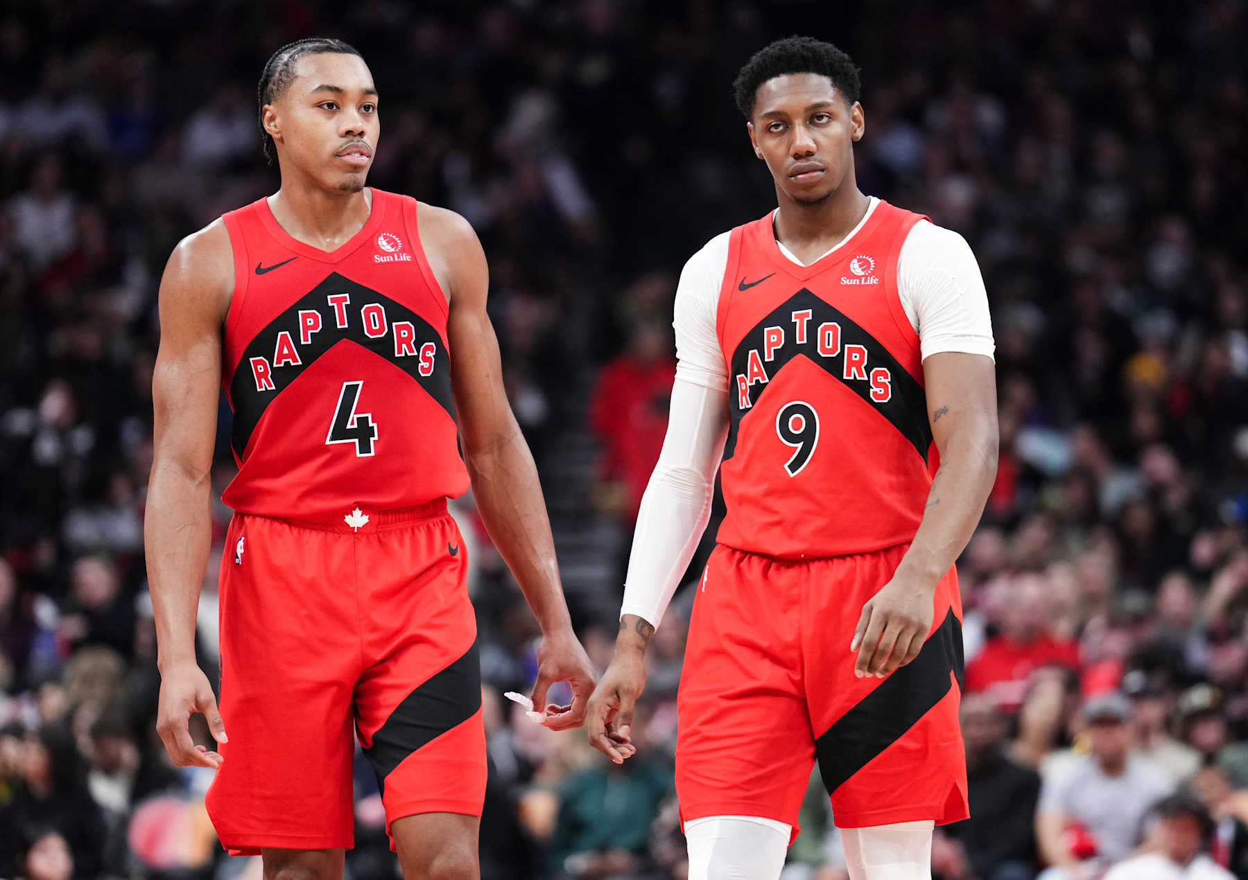 TORONTO, ON - DECEMBER 29: Scottie Barnes #4 and RJ Barrett #9 of the Toronto Raptors look on in a break in play against the Atlanta Hawks during the first half of their basketball game at the Scotiabank Arena on December 29, 2024 in Toronto, Ontario, Canada. NOTE TO USER: User expressly acknowledges and agrees that, by downloading and/or using this Photograph, user is consenting to the terms and conditions of the Getty Images License Agreement. (Photo by Mark Blinch/Getty Images)