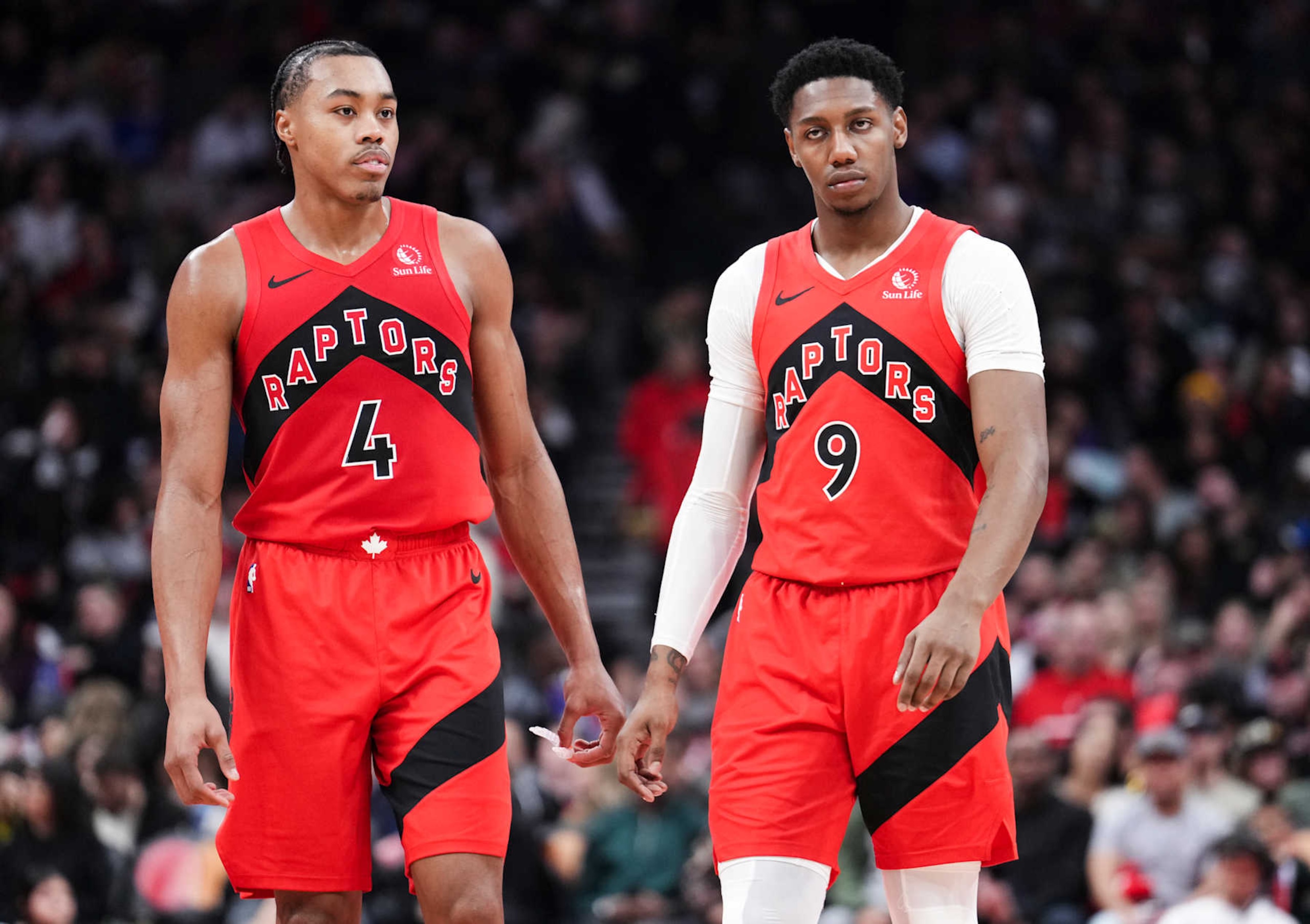 TORONTO, ON - DECEMBER 29: Scottie Barnes #4 and RJ Barrett #9 of the Toronto Raptors look on in a break in play against the Atlanta Hawks during the first half of their basketball game at the Scotiabank Arena on December 29, 2024 in Toronto, Ontario, Canada. NOTE TO USER: User expressly acknowledges and agrees that, by downloading and/or using this Photograph, user is consenting to the terms and conditions of the Getty Images License Agreement. (Photo by Mark Blinch/Getty Images)