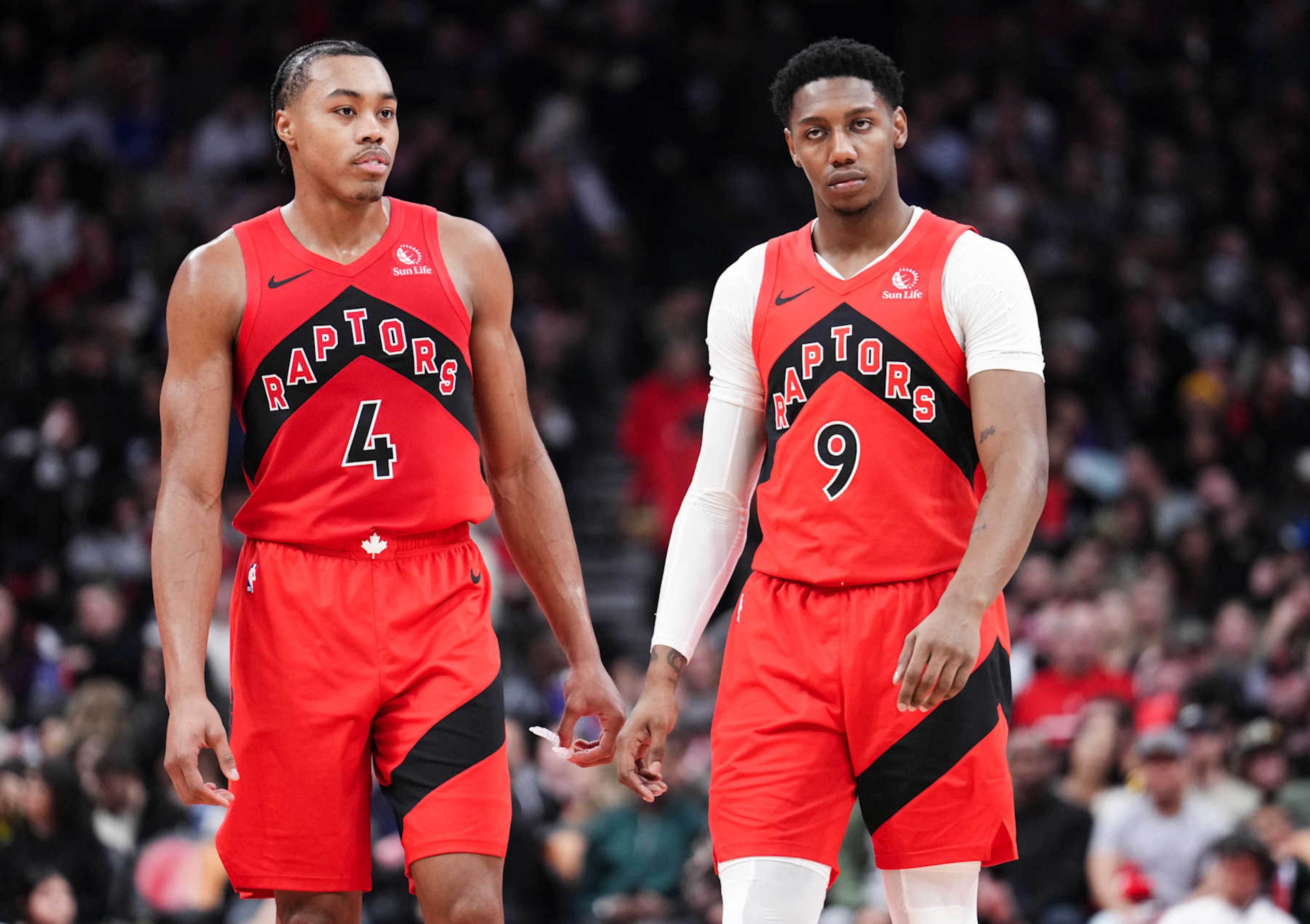 TORONTO, ON - DECEMBER 29: Scottie Barnes #4 and RJ Barrett #9 of the Toronto Raptors look on in a break in play against the Atlanta Hawks during the first half of their basketball game at the Scotiabank Arena on December 29, 2024 in Toronto, Ontario, Canada. NOTE TO USER: User expressly acknowledges and agrees that, by downloading and/or using this Photograph, user is consenting to the terms and conditions of the Getty Images License Agreement. (Photo by Mark Blinch/Getty Images)