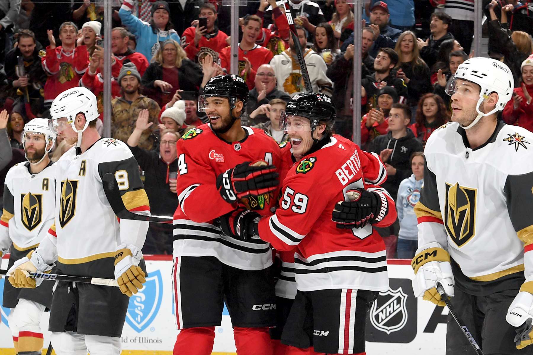 CHICAGO, ILLINOIS - JANUARY 18: Seth Jones #4 and Tyler Bertuzzi #59 of the Chicago Blackhawks react after Bertuzzi scores against the Vegas Golden Knights in the third period at the United Center on January 18, 2025 in Chicago, Illinois. (Photo by Bill Smith/NHLI via Getty Images)