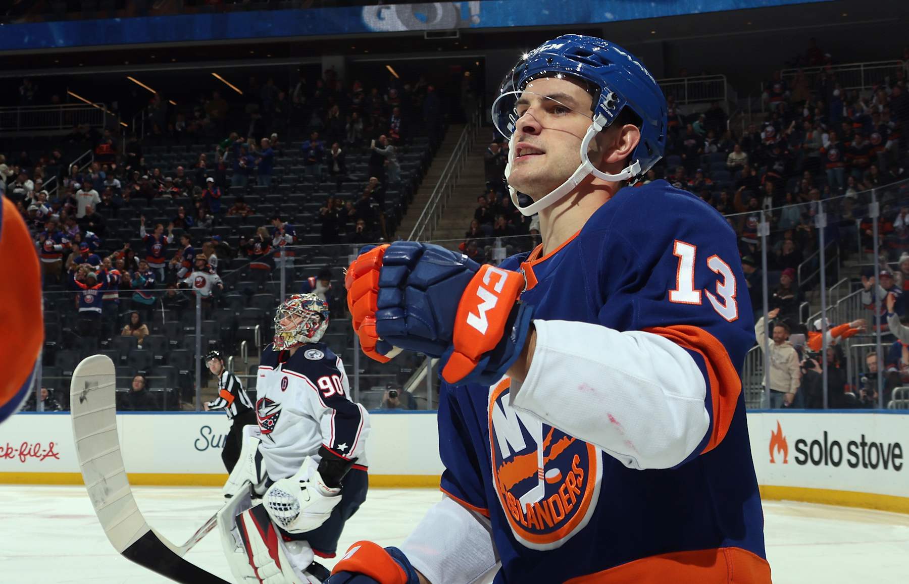 ELMONT, NEW YORK - JANUARY 20: Mathew Barzal #13 of the New York Islanders celebrates a goal by Bo Horvat #14 (not shown) against the Columbus Blue Jackets at 43 seconds of the second period at UBS Arena on January 20, 2025 in Elmont, New York. (Photo by Bruce Bennett/Getty Images)