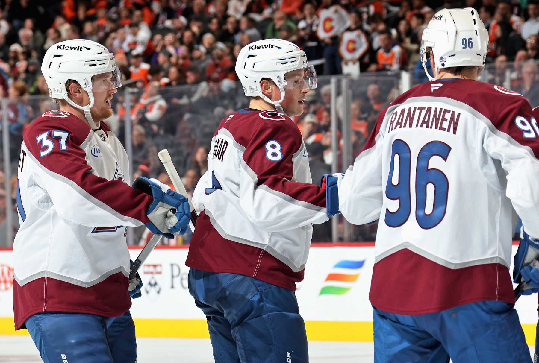 PHILADELPHIA, PENNSYLVANIA - NOVEMBER 18: Cale Makar #8 of the Colorado Avalanche celebrates his second period power-play goal against the Philadelphia Flyers with Casey Mittelstadt #37 and Mikko Rantanen #96 at the Wells Fargo Center on November 18, 2024 in Philadelphia, Pennsylvania. The goal was Makar's second of the game. (Photo by Len Redkoles/NHLI via Getty Images)