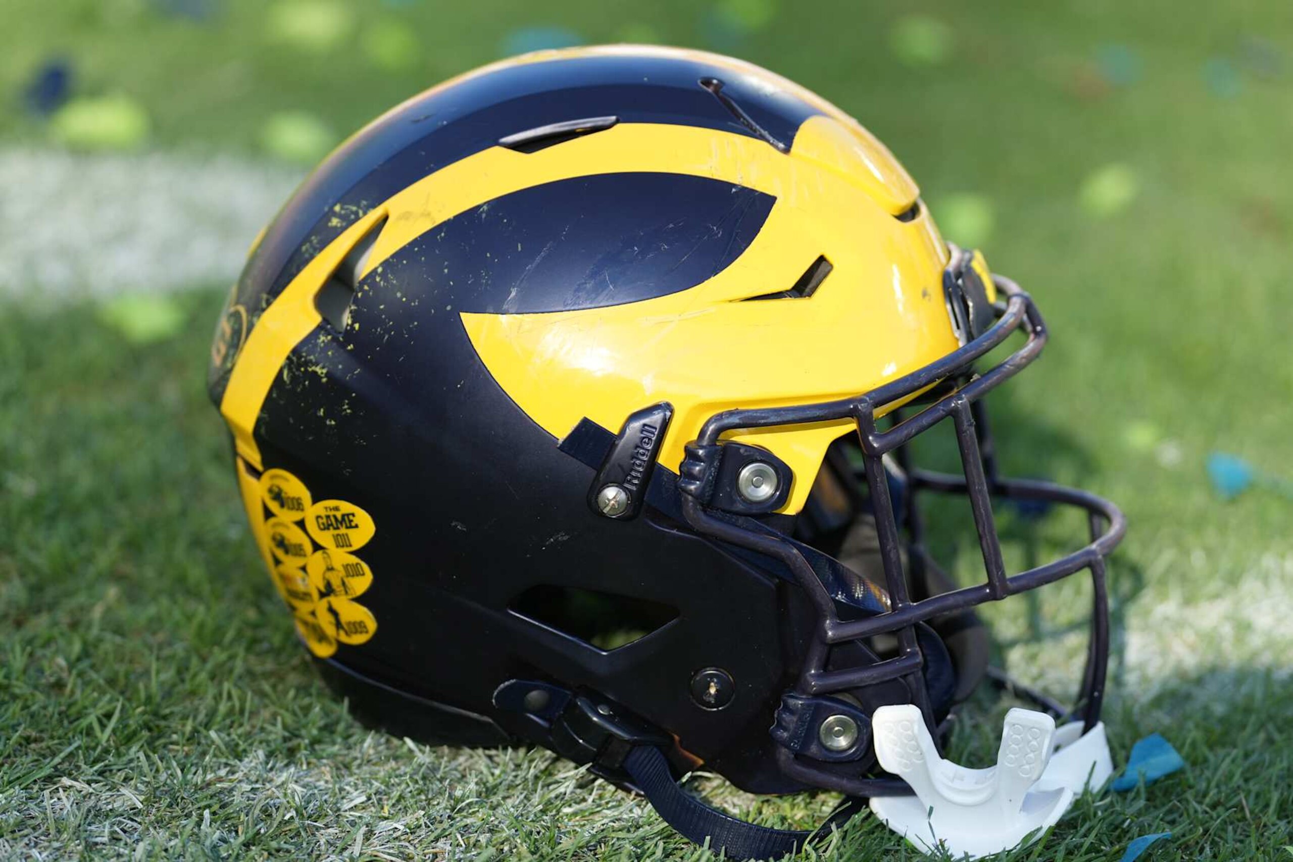 TAMPA, FL - DECEMBER 31: a Michigan Wolverines helmet rests near the sidelines during the ReliaQuest Bowl game between the Michigan Wolverines and the Alabama Crimson Tide on Tuesday, December 31, 2024 at Raymond James Stadium in Tampa, Fla. (Photo by Peter Joneleit/Icon Sportswire via Getty Images) TAMPA, FL - DECEMBER 31: a Michigan Wolverines helmet rests near the sidelines during the ReliaQuest Bowl game between the Michigan Wolverines and the Alabama Crimson Tide on Tuesday, December 31, 2024 at Raymond James Stadium in Tampa, Fla. (Photo by Peter Joneleit/Icon Sportswire via Getty Images)