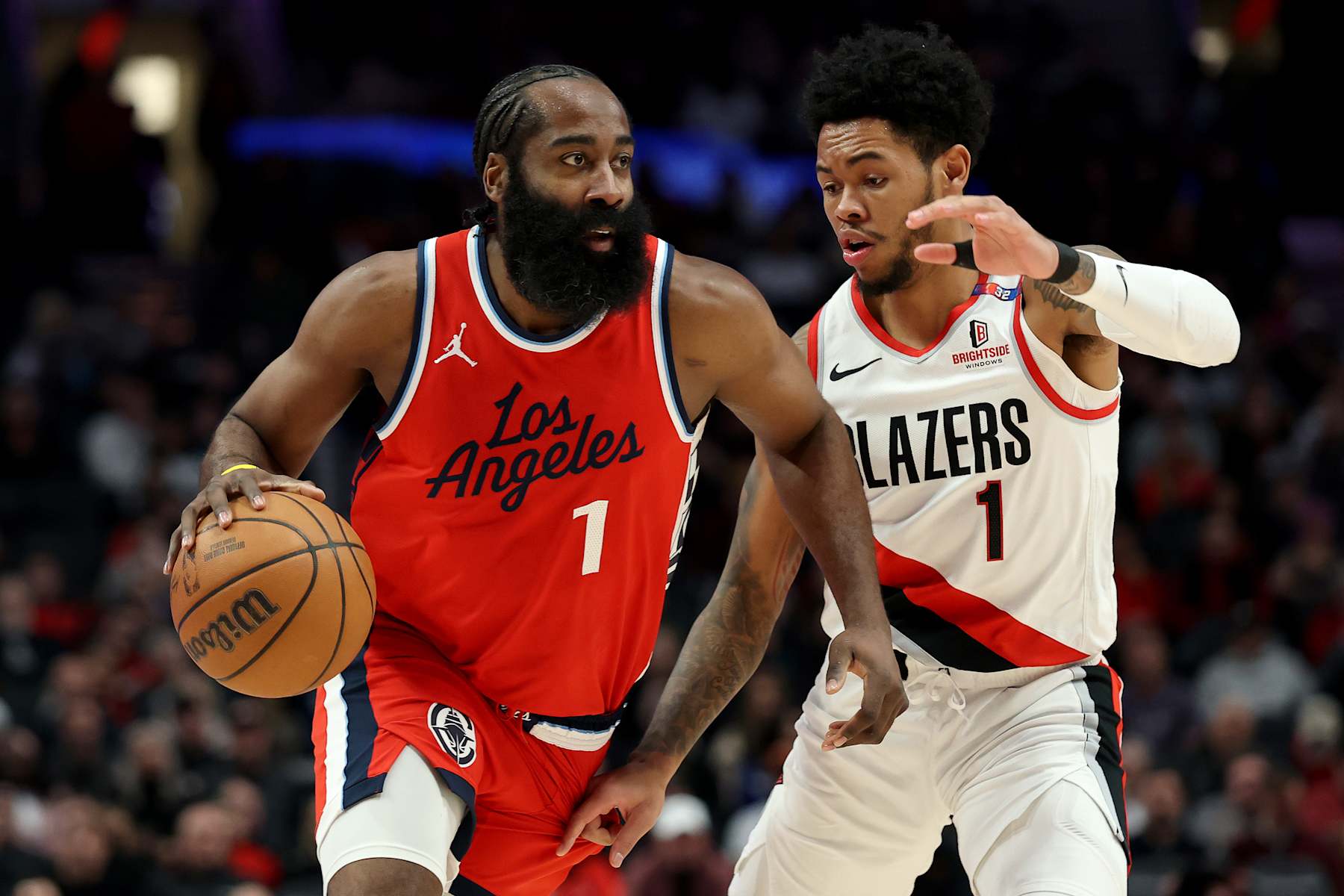 PORTLAND, OREGON - JANUARY 16: Anfernee Simons #1 of the Portland Trail Blazers defends James Harden #1 of the LA Clippers during the first half at Moda Center on January 16, 2025 in Portland, Oregon. NOTE TO USER: User expressly acknowledges and agrees that, by downloading and or using this photograph, User is consenting to the terms and conditions of the Getty Images License Agreement. (Photo by Steph Chambers/Getty Images)